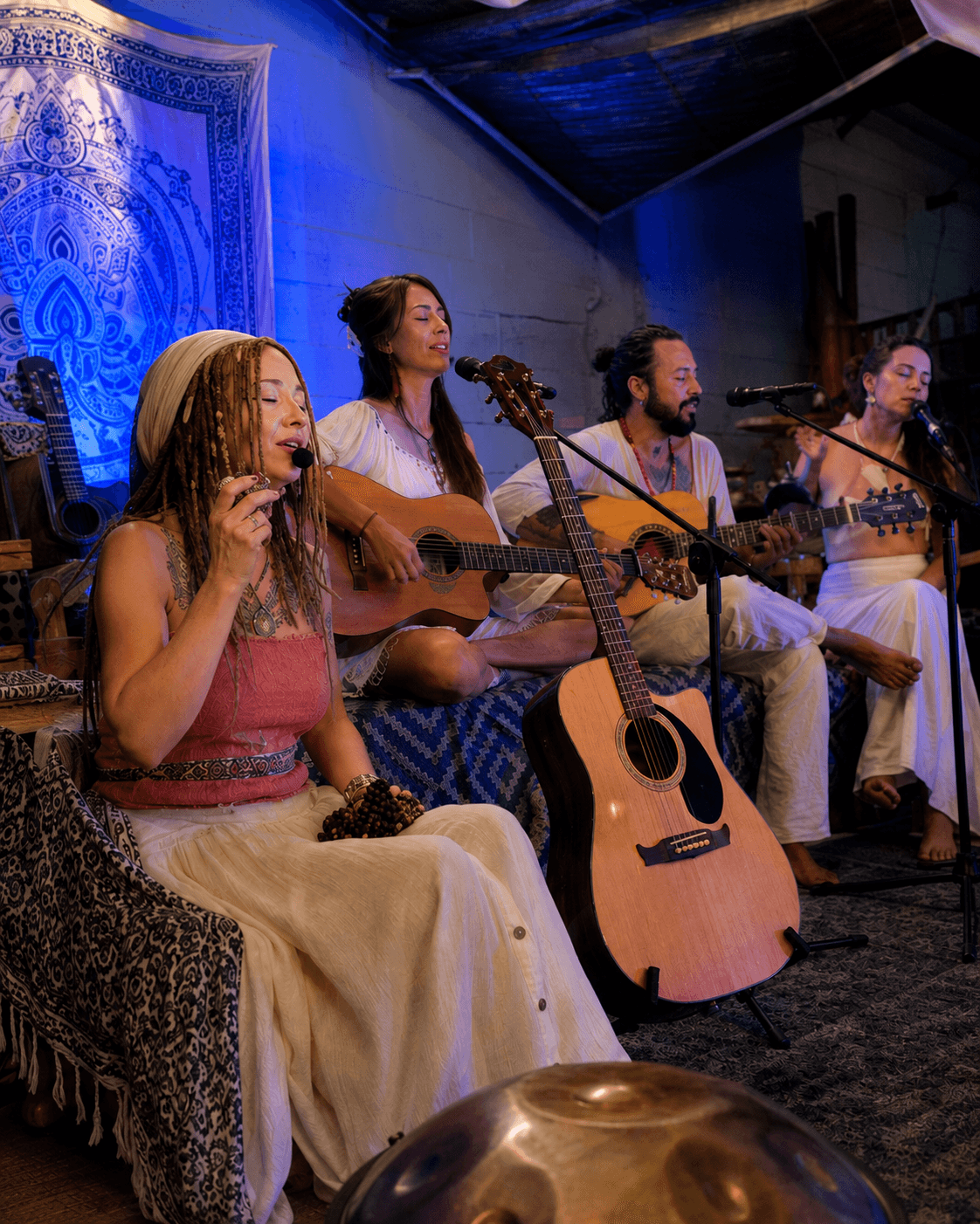 Crystal Aeyan singing and playing guitar