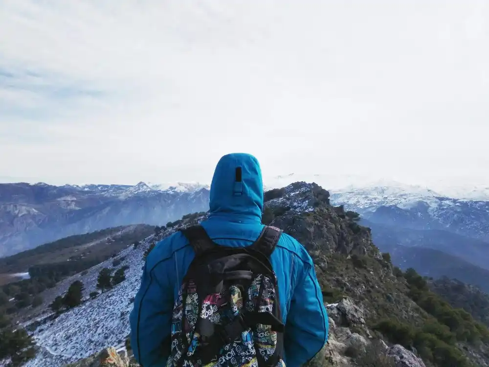 Carlos in the mountain with a bag