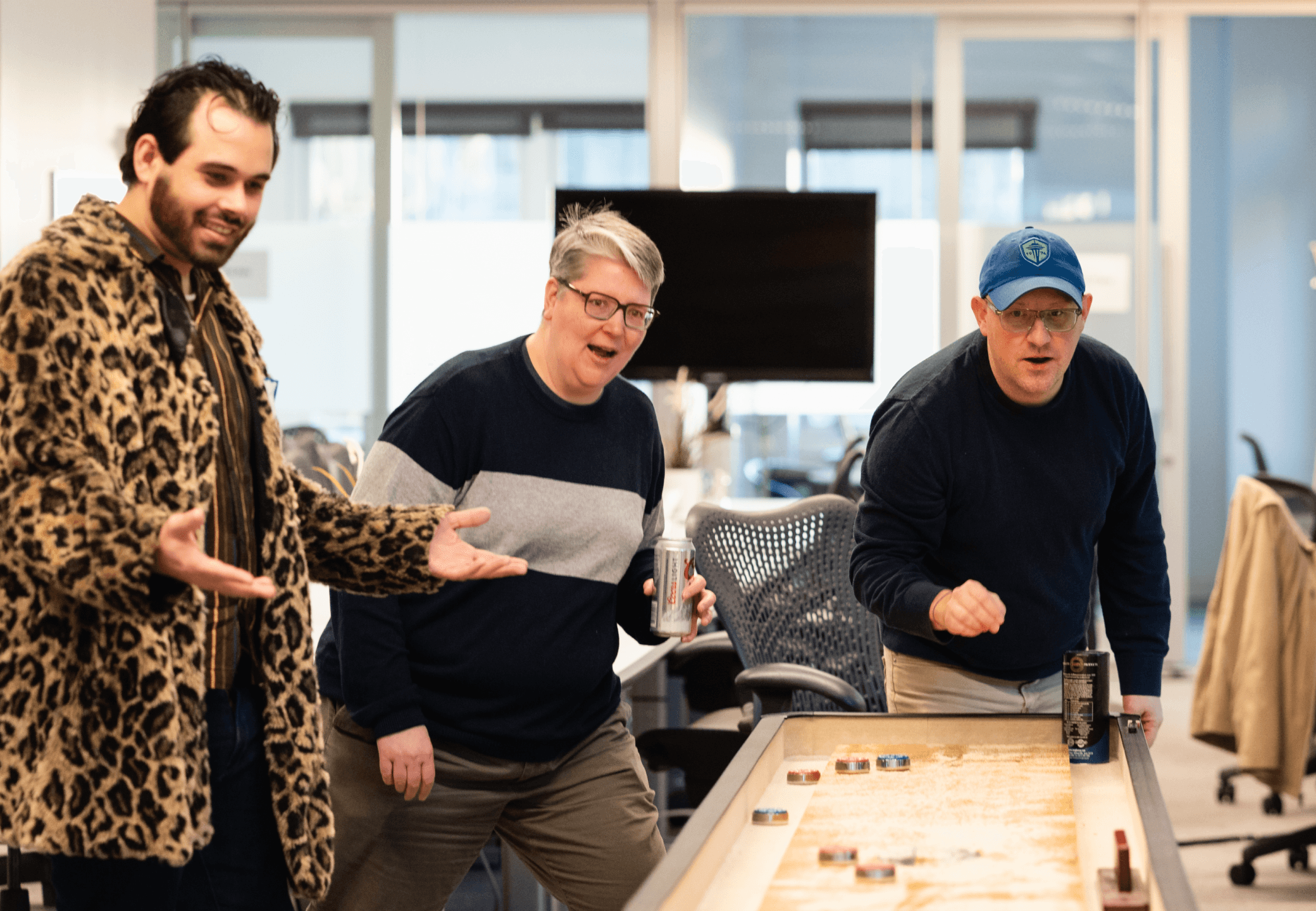 Possible employees playing shuffleboard.