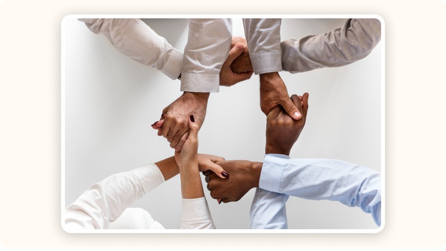 Clasping hands symbolizing collaboration and renewed commitment