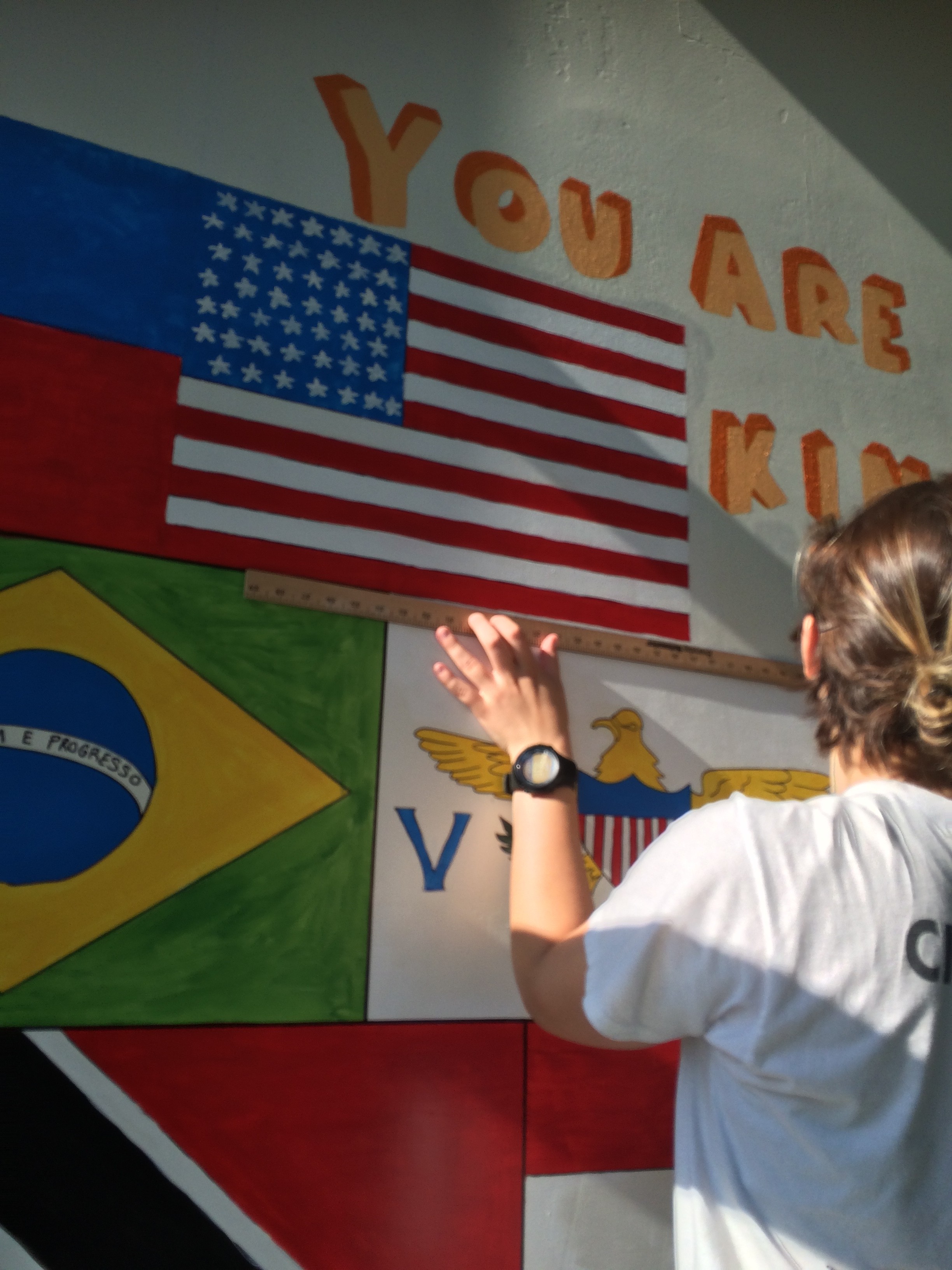 a blurry photo of a person standing in front of a wall
