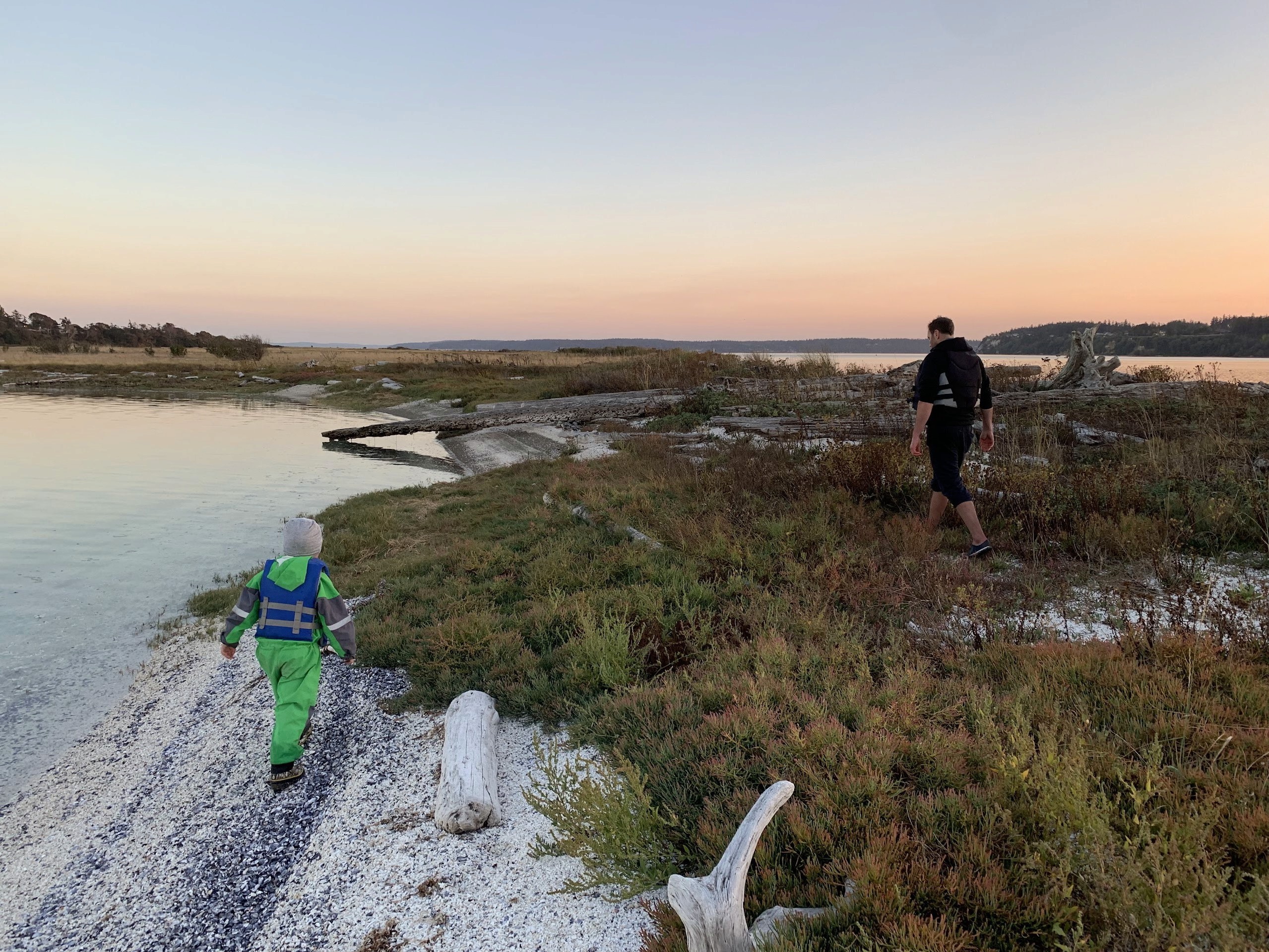 Black and white image of people working at a table with laptops, showing hands gesturing during discussion of digital content displayed on screens, with fabrica® logo in the corner.