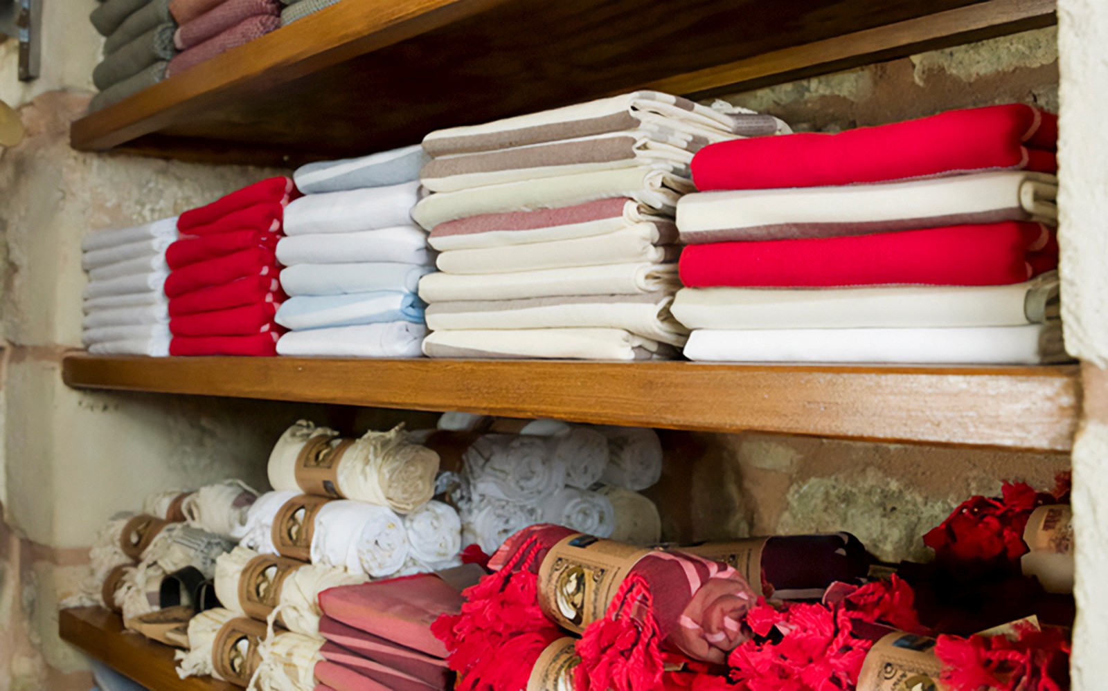 Folded towels on shelves in a Turkish hammam in Istanbul.