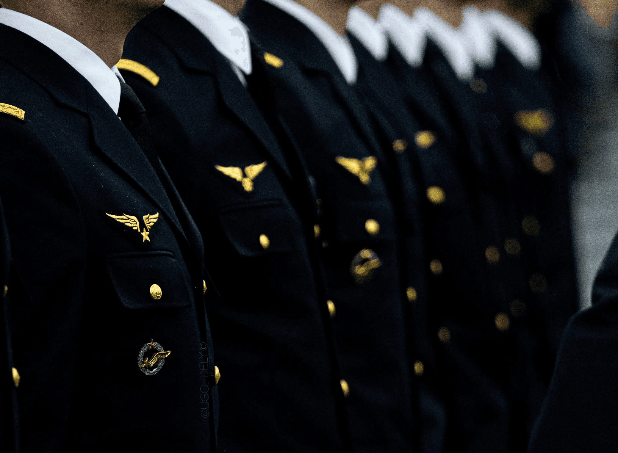 man in black and yellow uniform