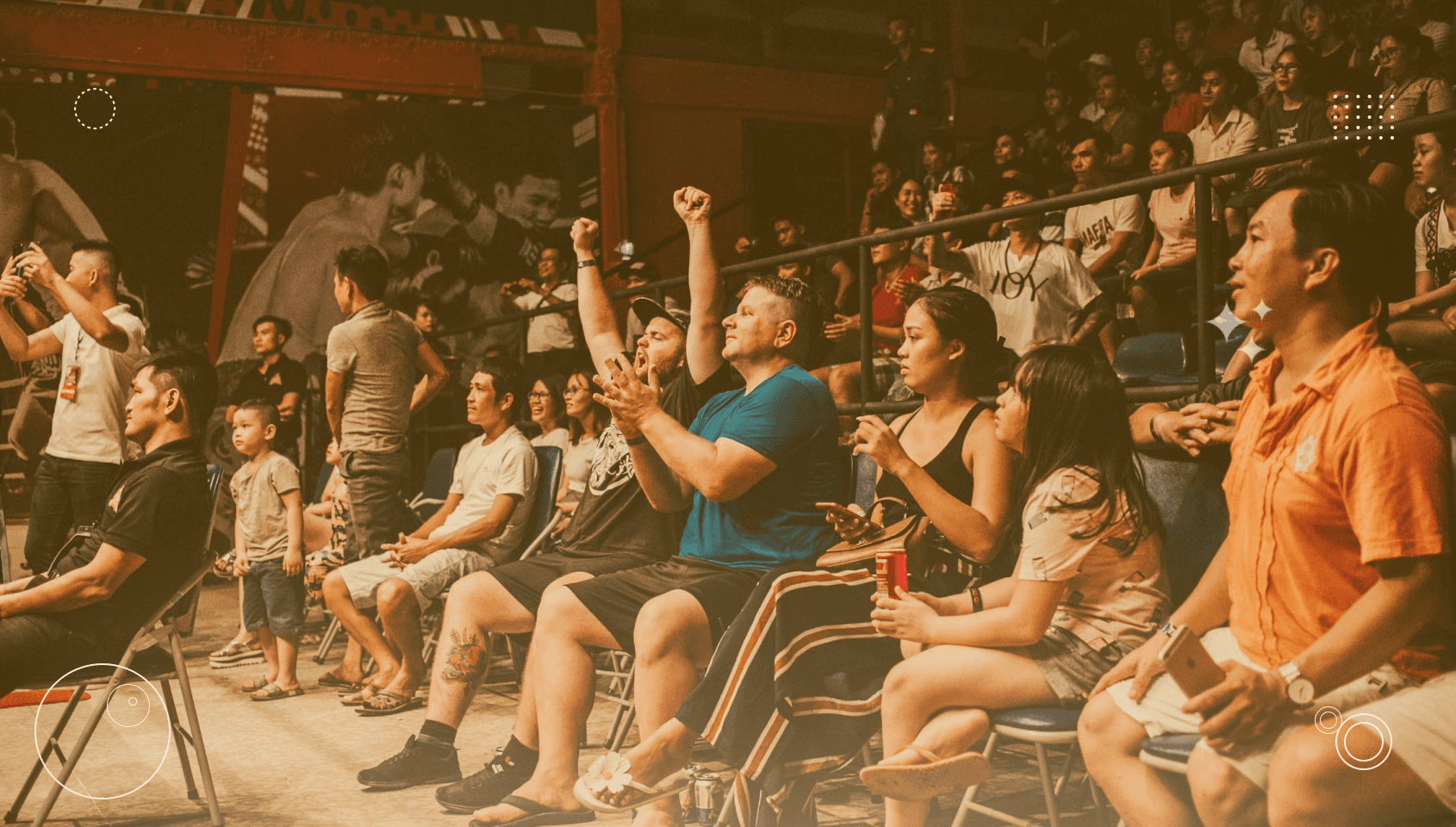Group of people in an offline community environment cheering for fellow community members.