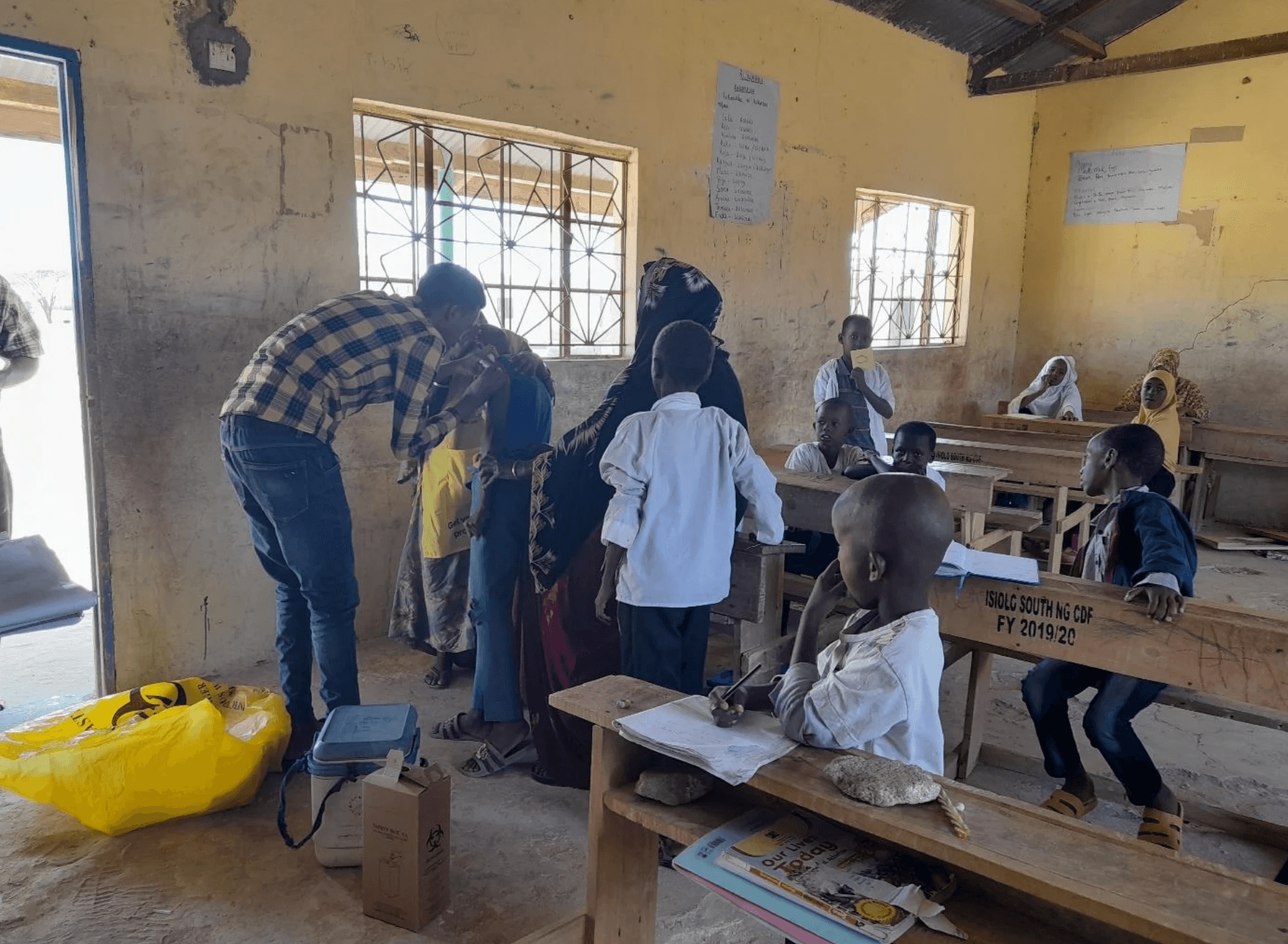 five toddlers near the window