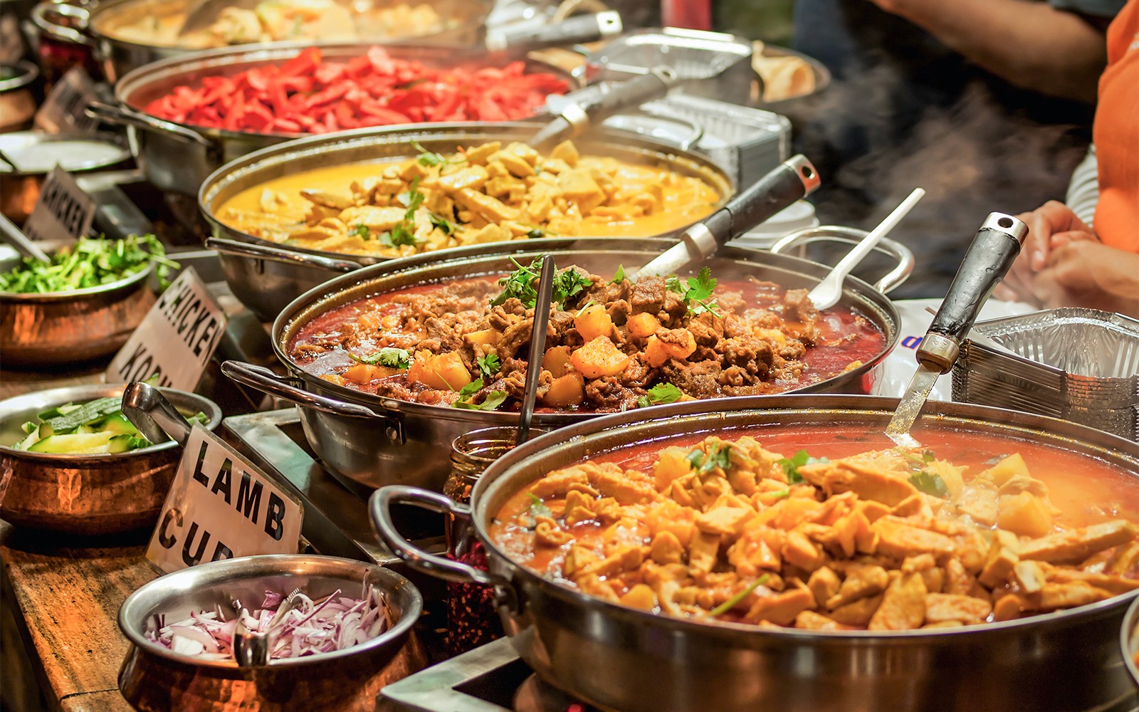 Indian buffet with various curries and dishes at KL Tower restaurant.