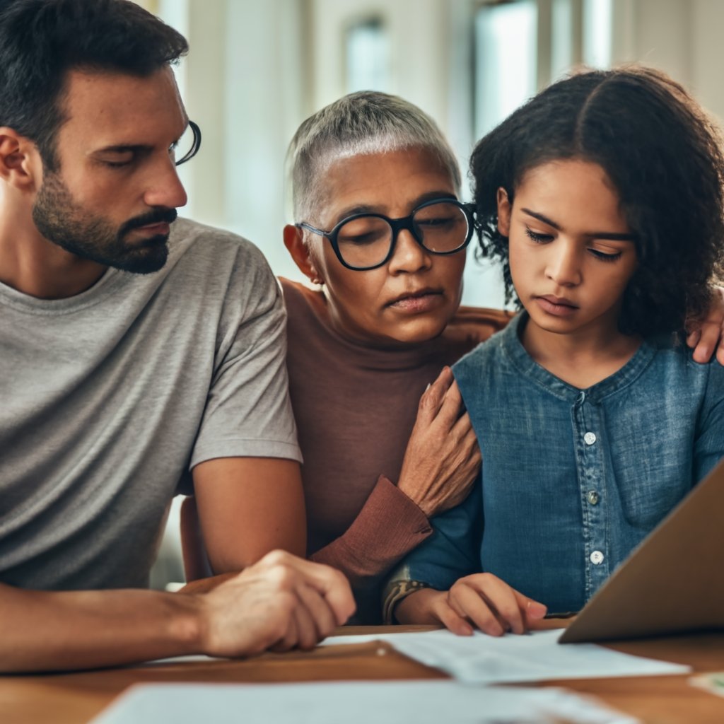 A concerned family discussing paperwork