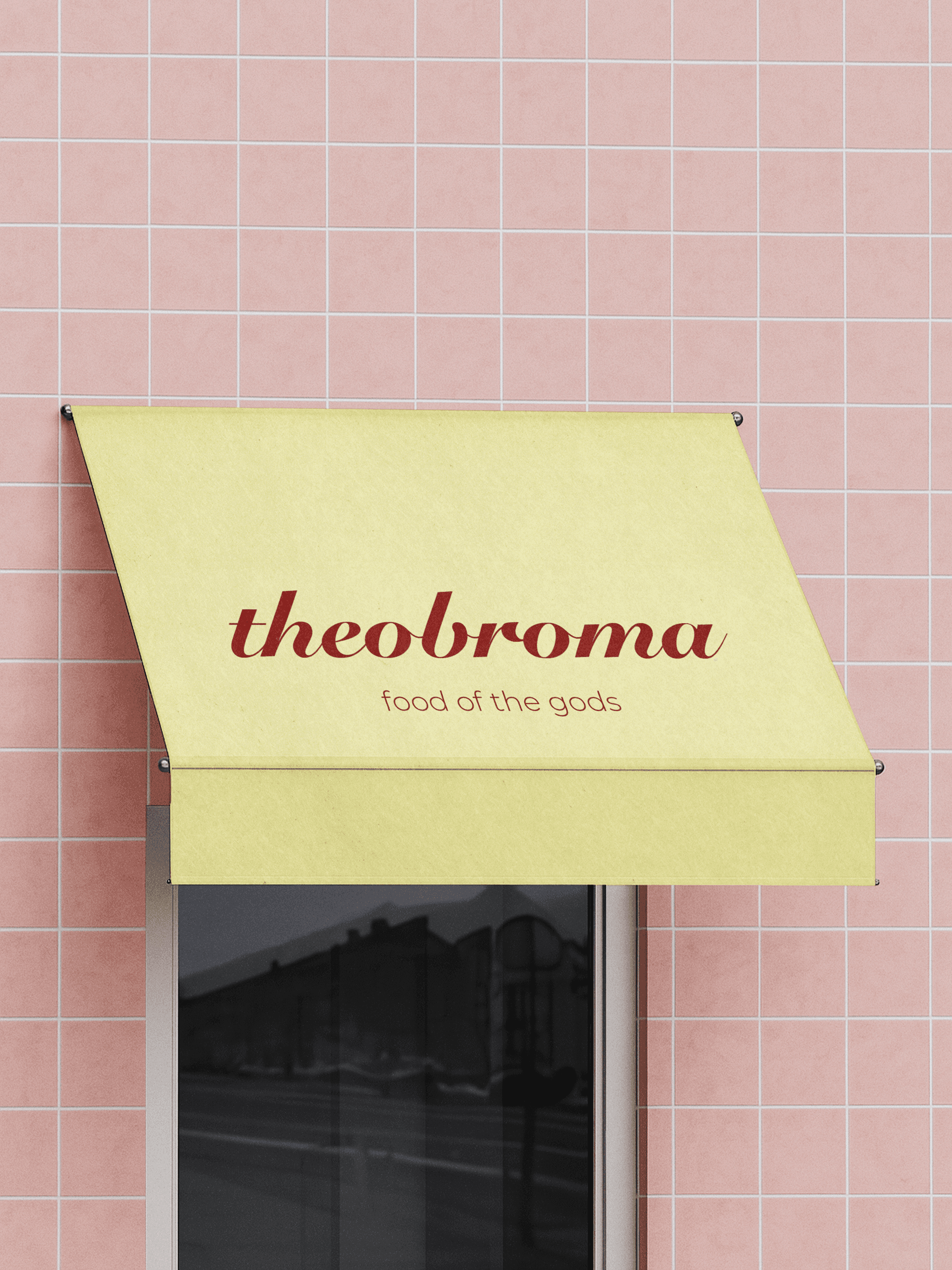 Close-up of hand holding pink ice cream cone against pastel background