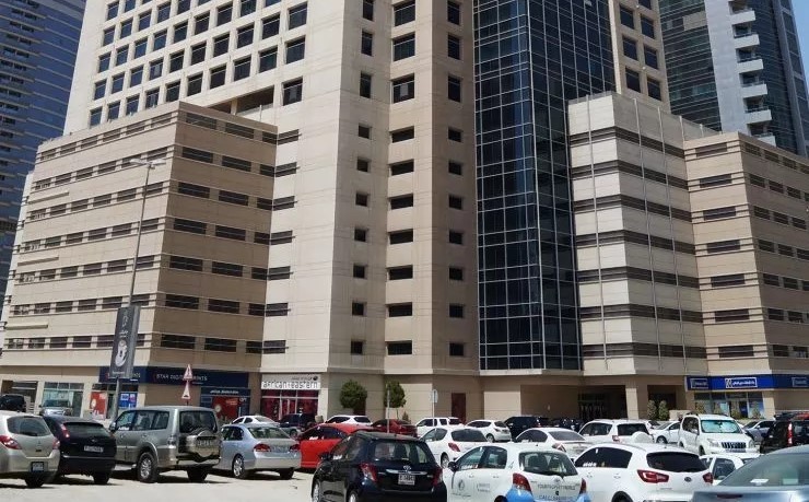 Full exterior of Grosvenor Business Tower, showcasing prime office space for lease in Barsha Heights.