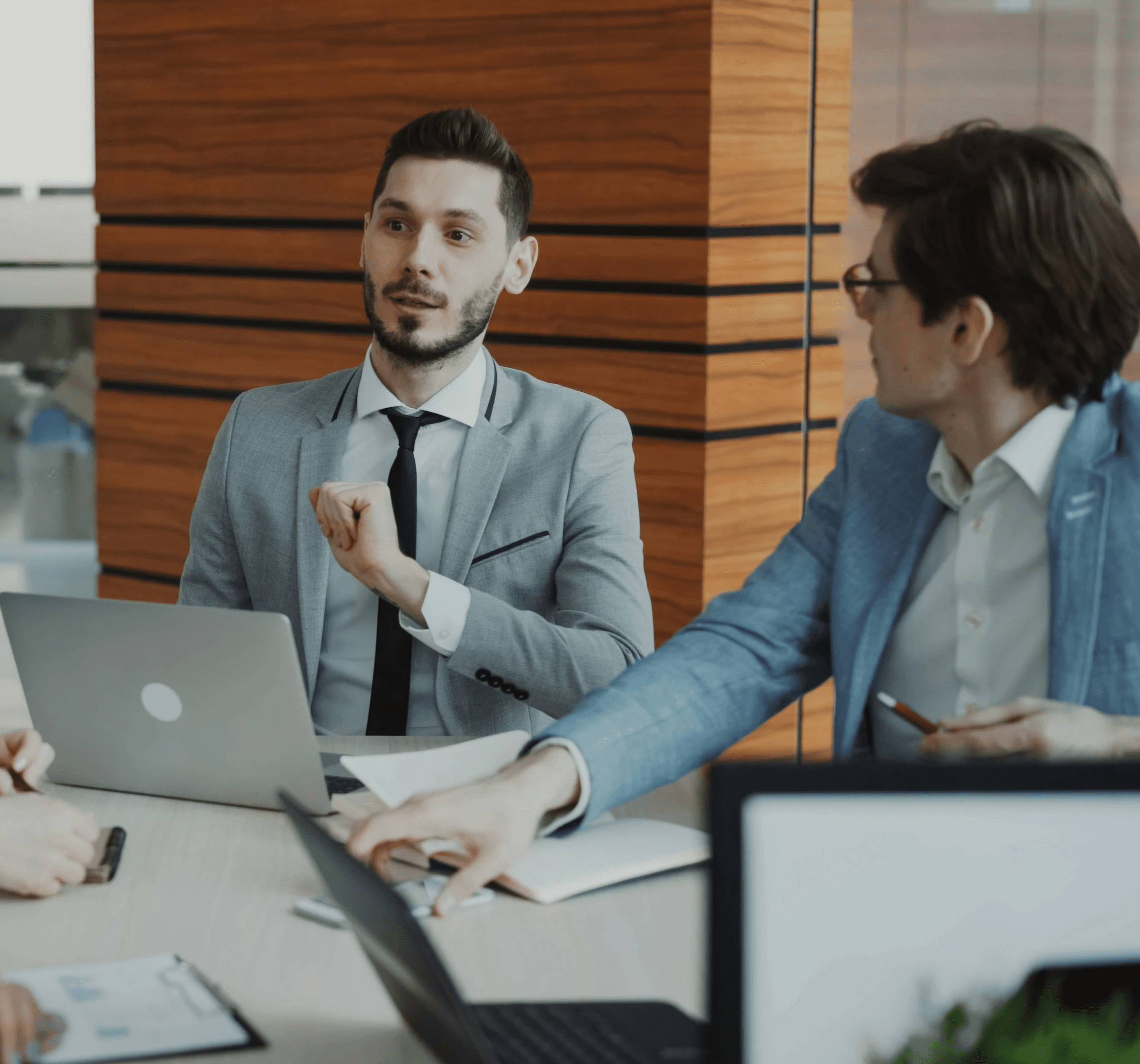 Business people collaborating in a modern office meeting.