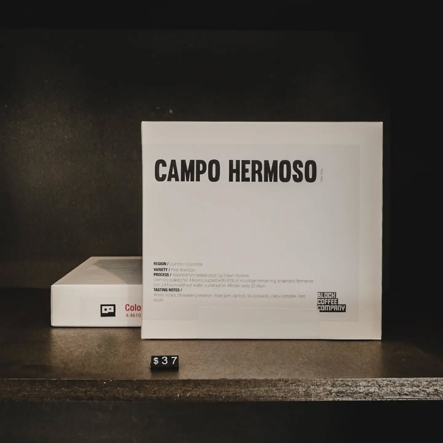 a black cellphone with a white letter on it