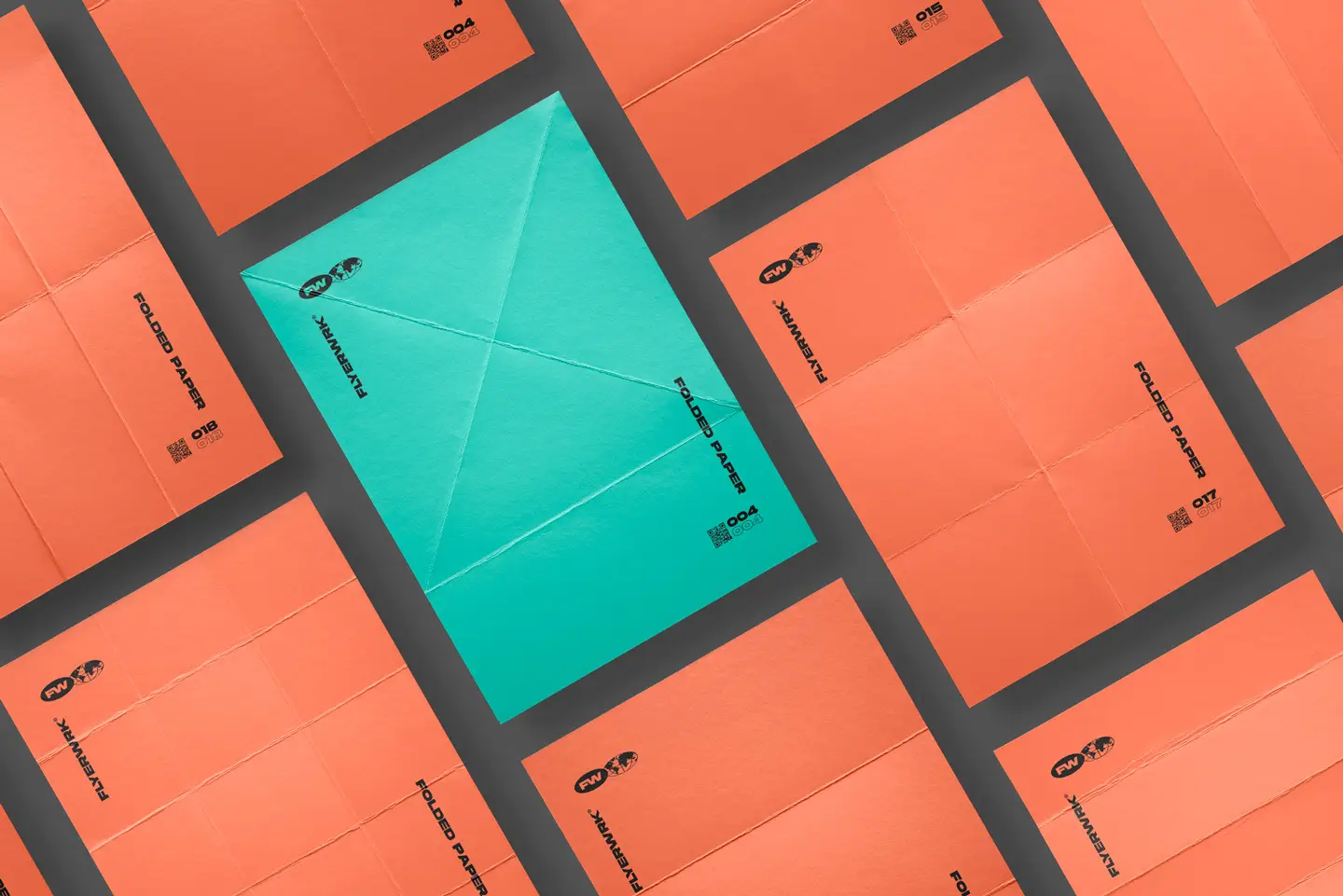 Folded paper sheets in orange and teal colors showing realistic creased paper texture and depth