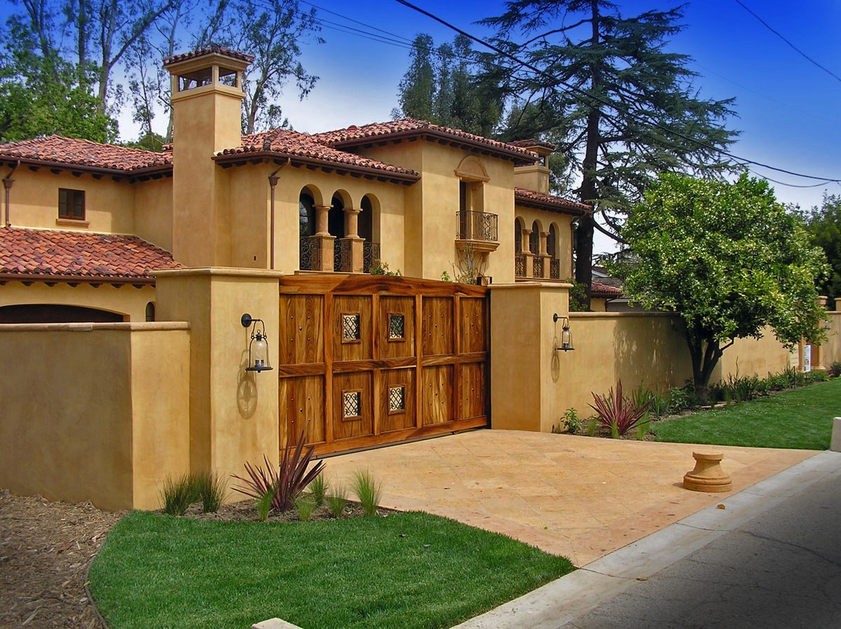 Exterior view from the street, featuring a custom wood gate, welcoming visitors with its classic design.