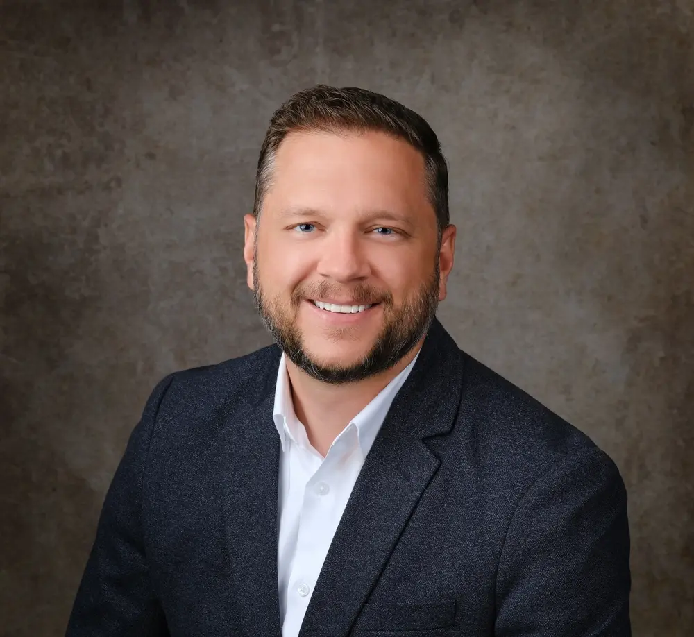 headshot of Justin Barton, founder of Summit Ledger Ops