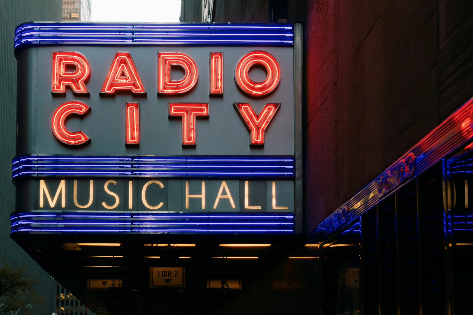Iconic neon sign for Radio City Music Hall in New York City, a famous entertainment venue.