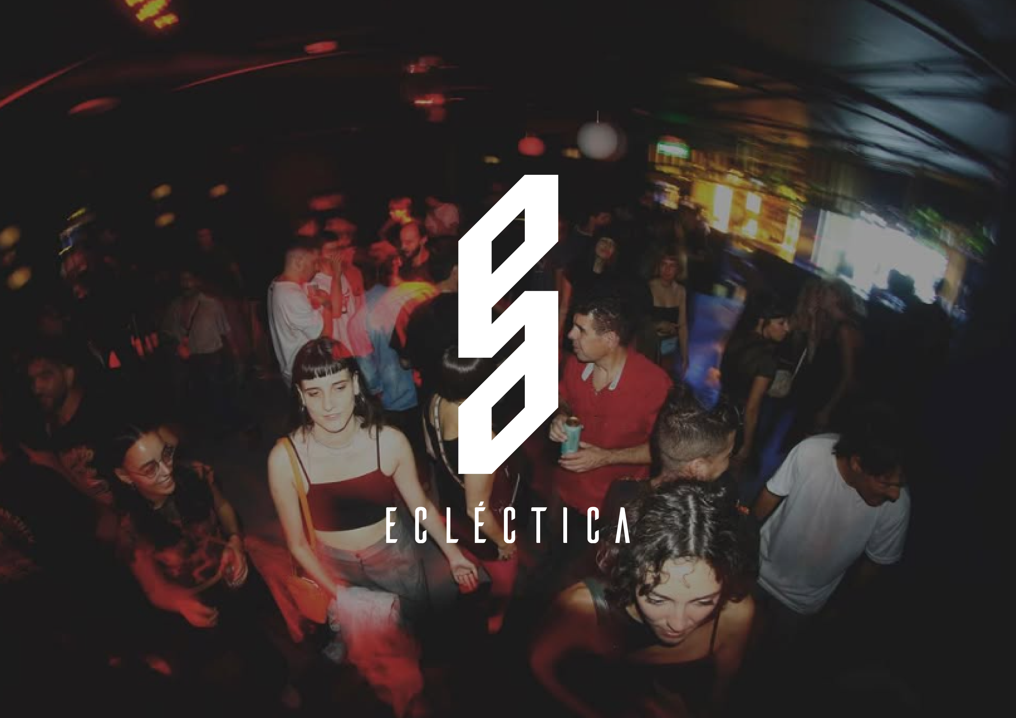 Person standing at cave entrance overlooking snowy forest