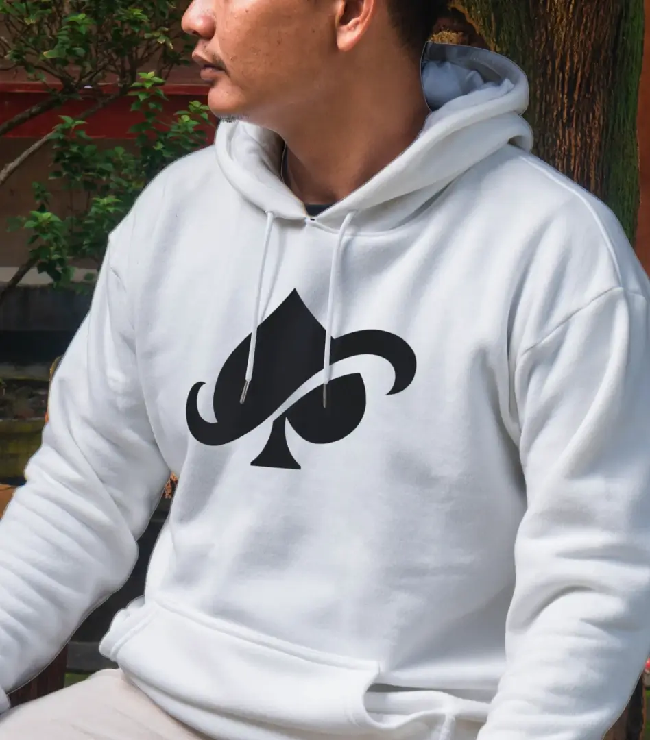 Man wearing a white hoodie printed with the Spinx spade icon.