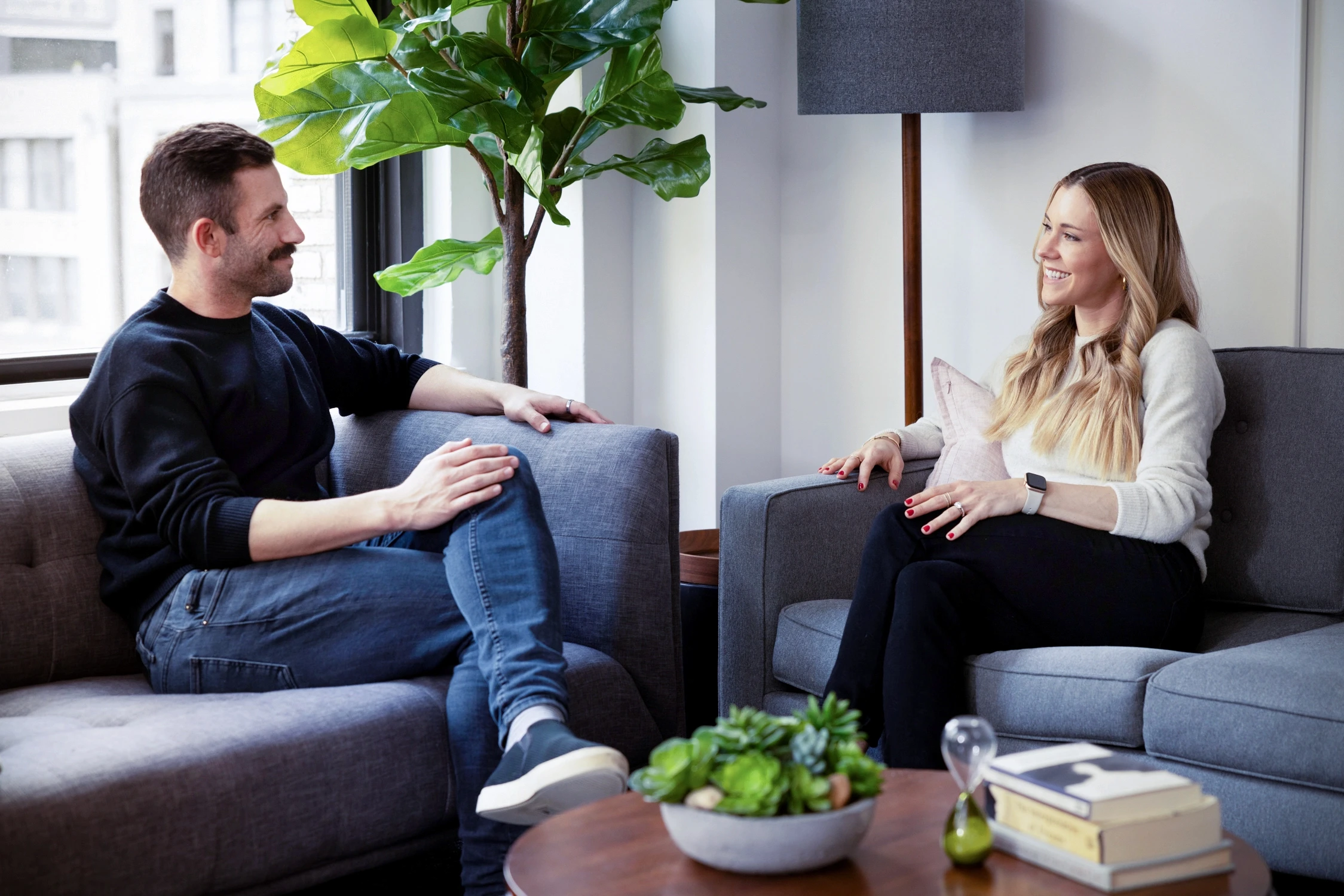 a photo of an in person therapy session being held in New York city therapy office representing inclusivity, face-to-face, support with a therapist in the same room. for a deeper sense of connection and emotional safety.
