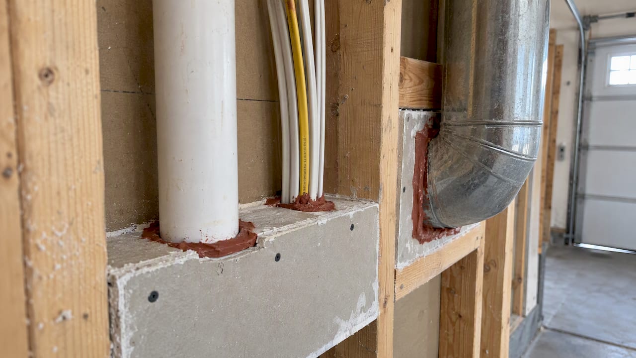 Fire-blocking material sealing wall penetrations