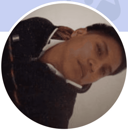 A person in a blue coat smiling