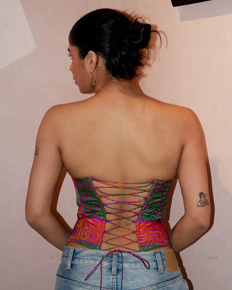 Raina four-panel corset handcrafted from vintage silk saree with structured silhouette, V-cut front, and lace-up panels for adjustable fit.