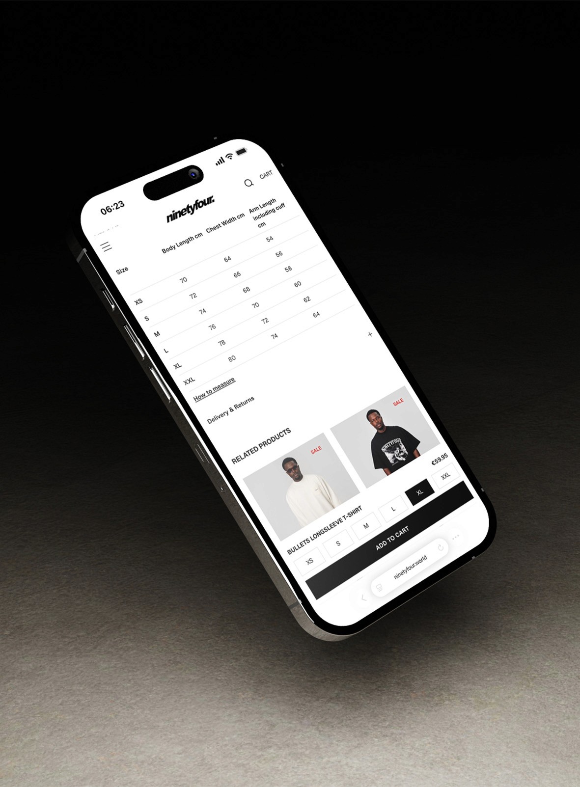 Hand touching glowing turquoise water near dark rocks