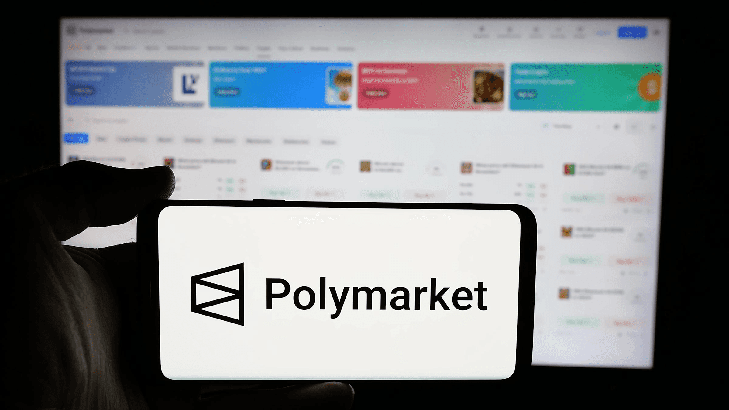 Person using Polymarket on mobile device - Why Does Polymarket Have a Waitlist 