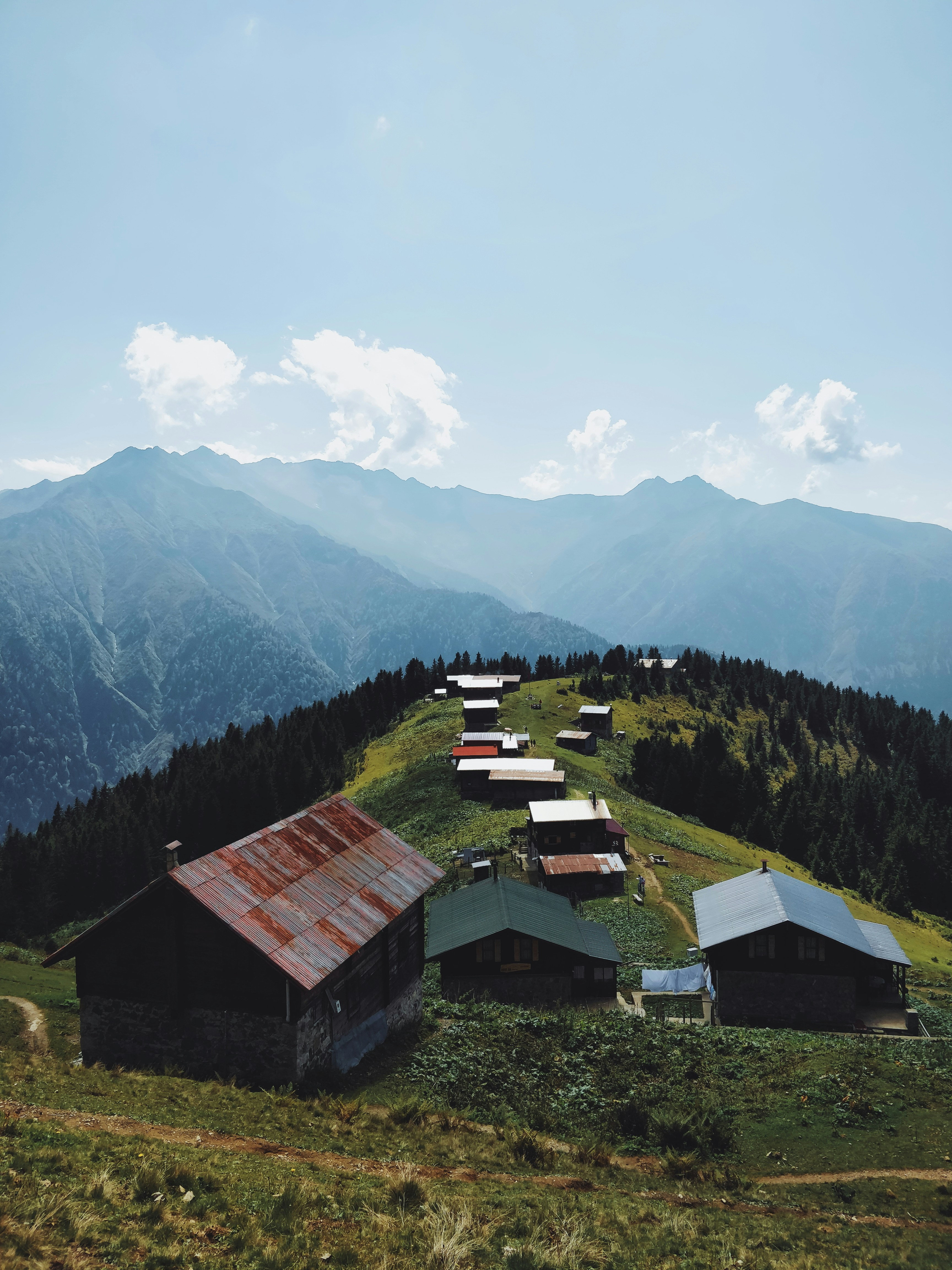 wide angle photography of buildings near mountain during daytime