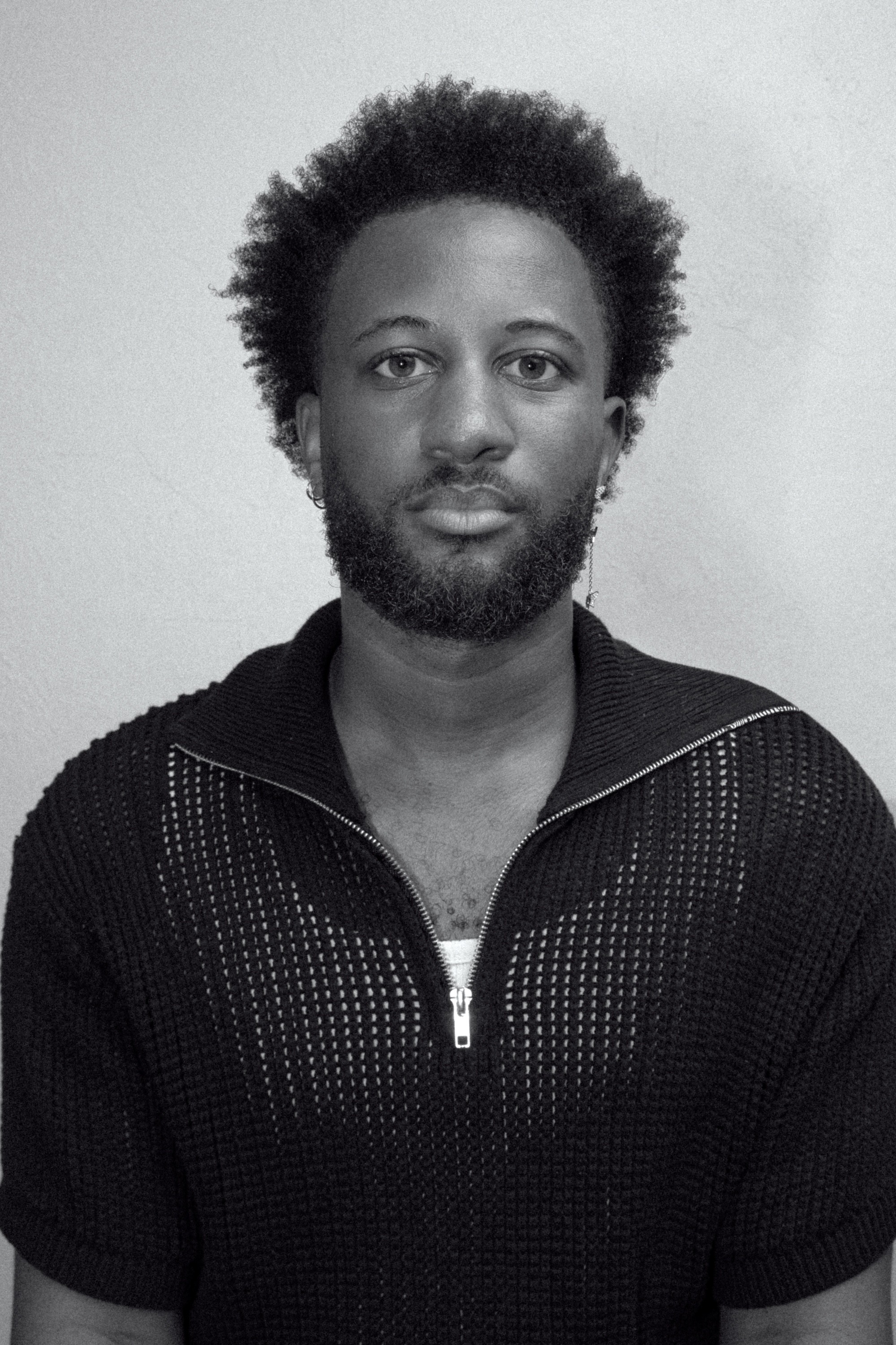 a blurry photo of a person standing in front of a wall