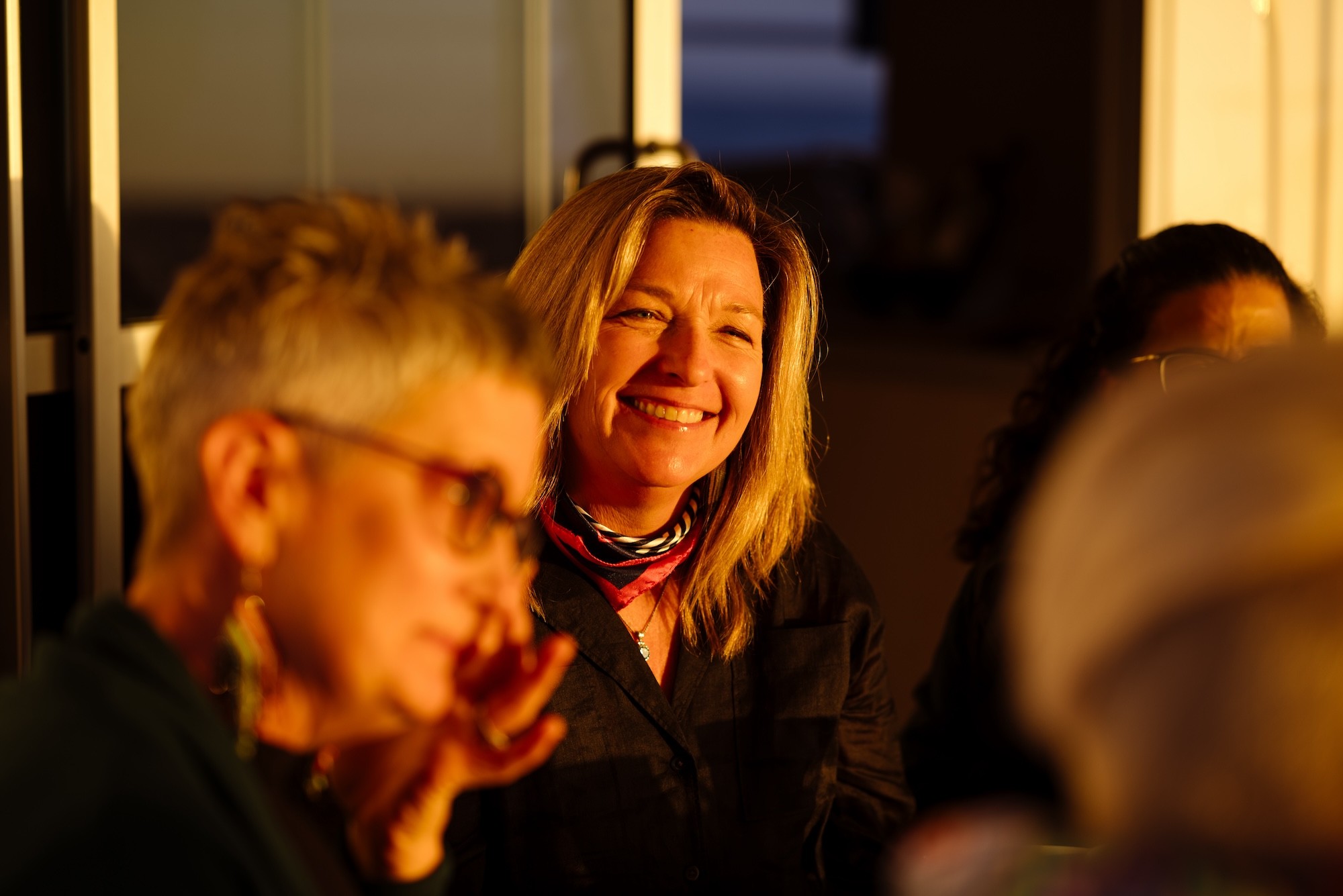 Lexi smiling in the sunshine