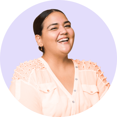 A smiling man wearing a green button-up shirt.