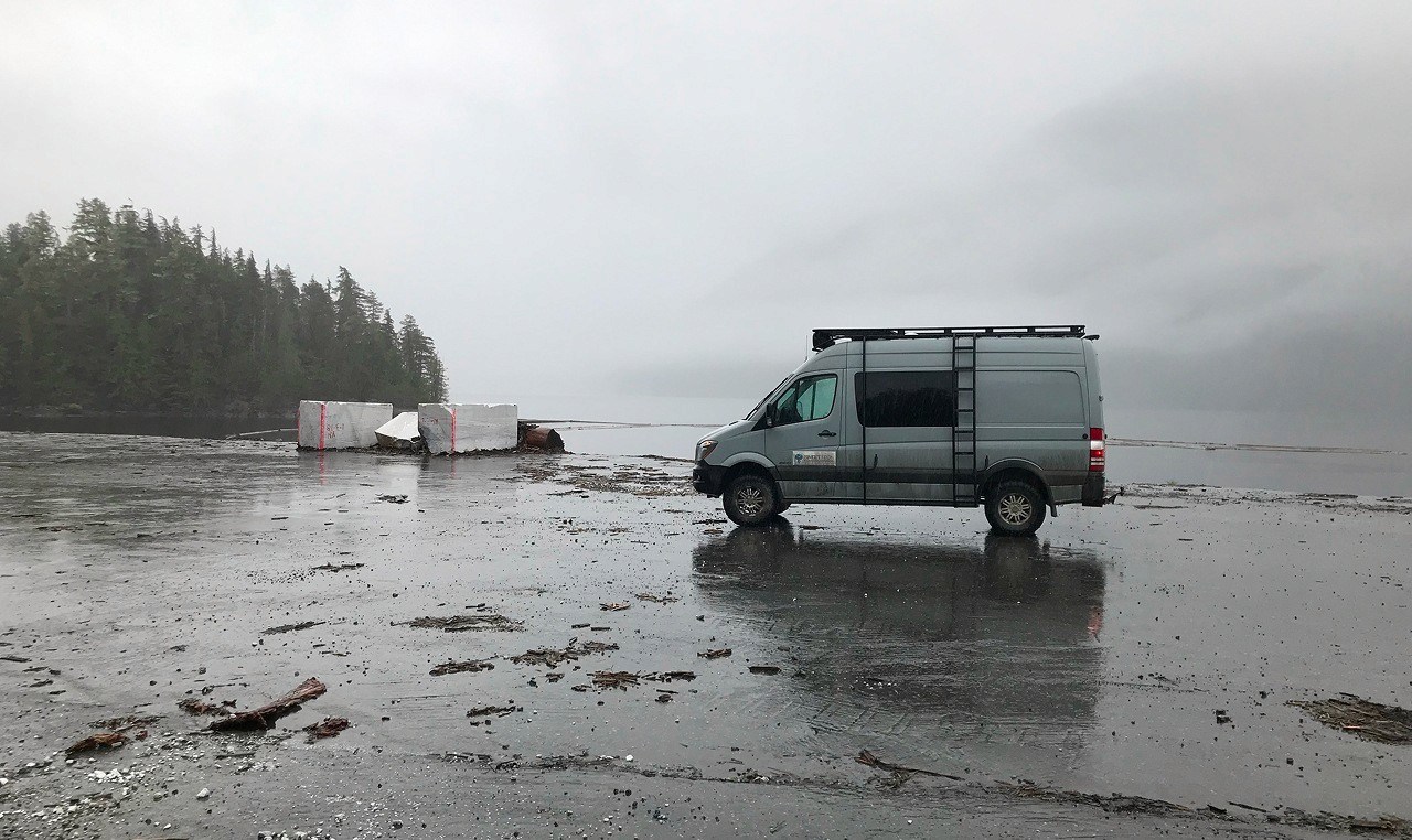 SweetTech vehicle at tidal quarry access area with marble blocks during coastal site assessment