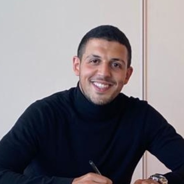 a man wearing glasses and a black shirt