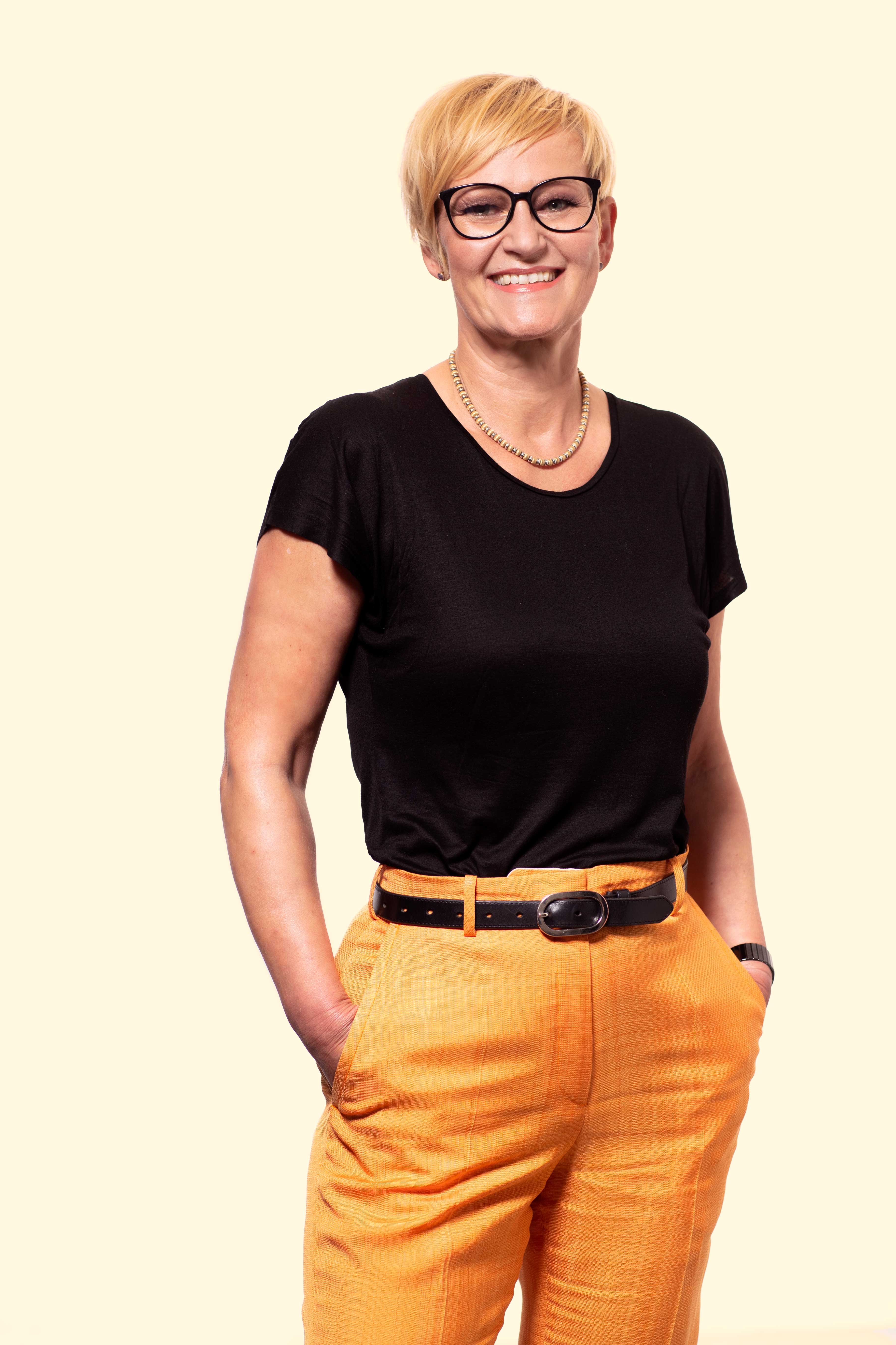 Girl standing in colorful pastel background