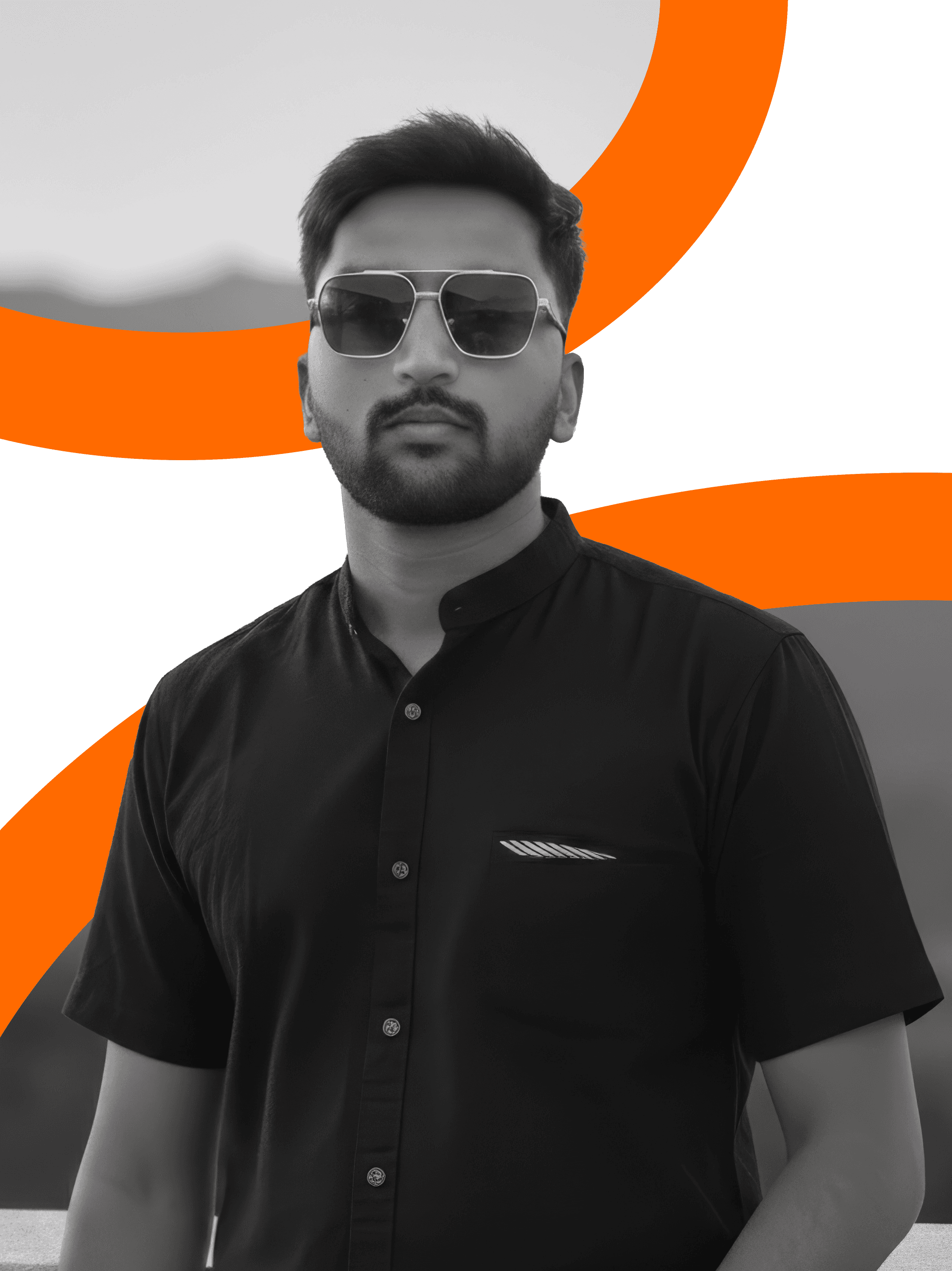 A thoughtful young person with dark hair gazes to the side, captured in soft black and white lighting.