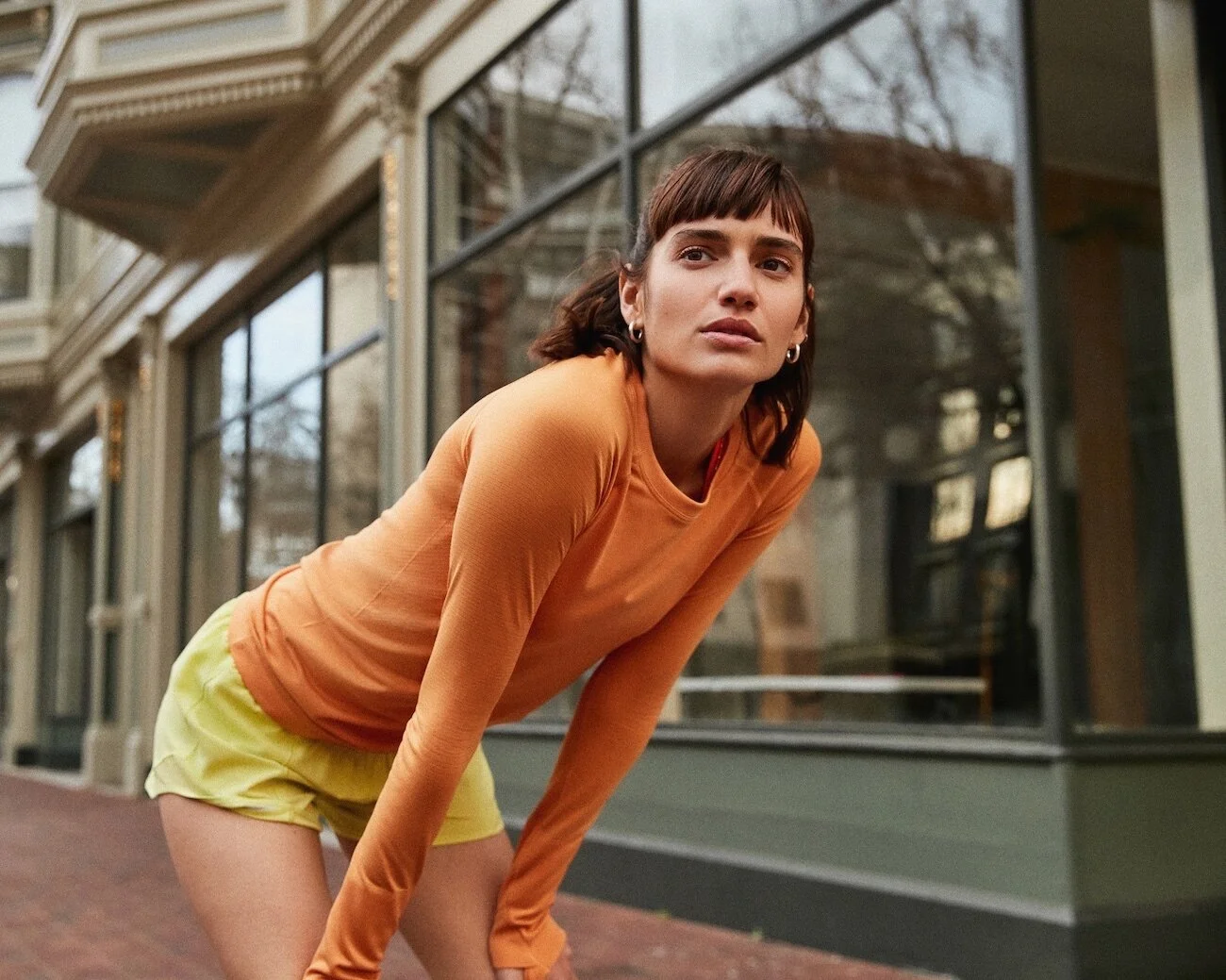 female athlete resting after running