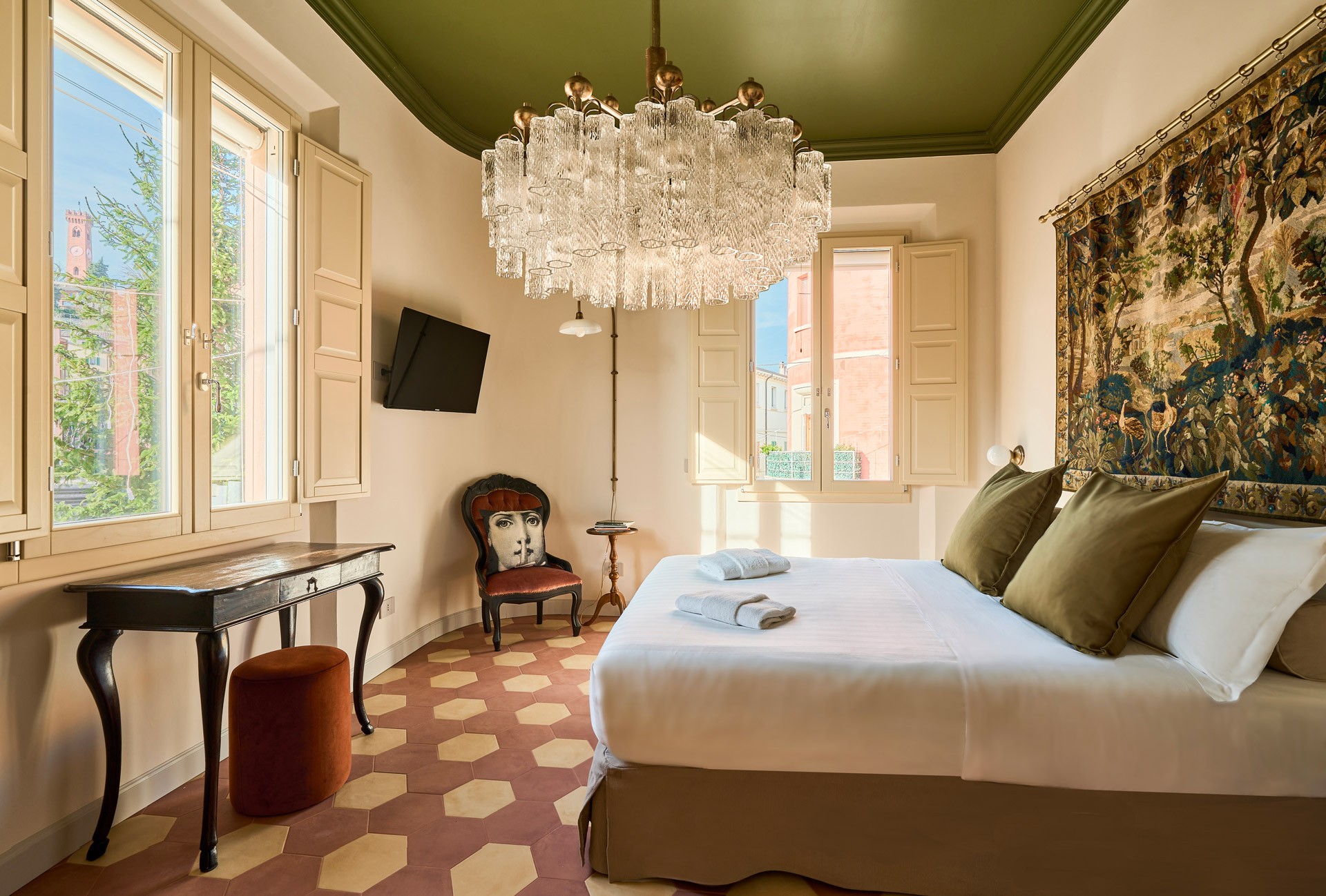 A close-up of a serene face illuminated by soft light, with shadows creating a patterned effect across the skin.