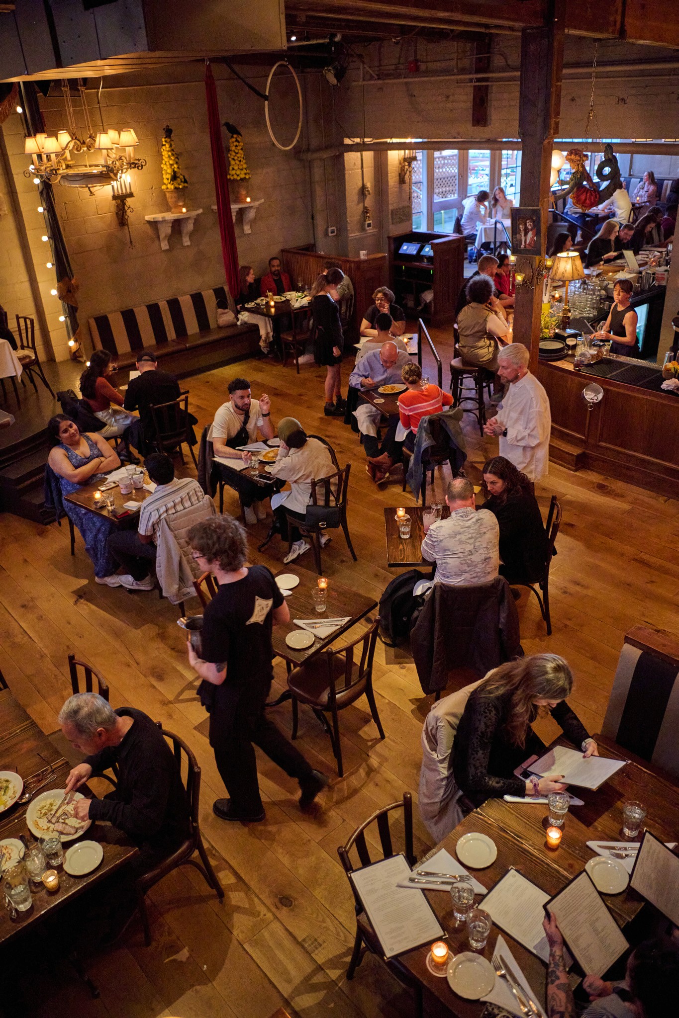 Customers dining in Lounge viewed from stairs
