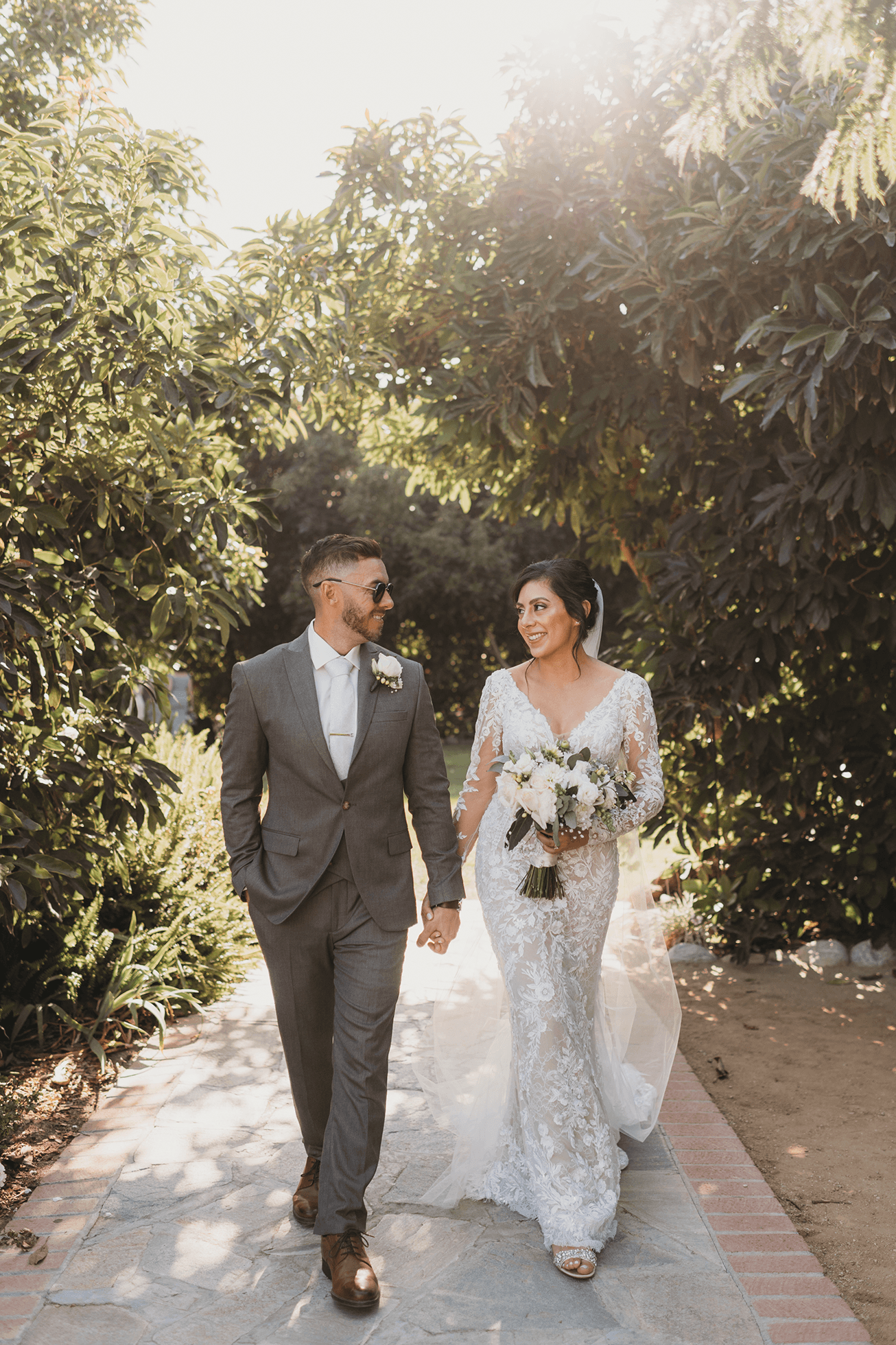 Flat lay wedding details with bouquet, rings, and sparkling bridal heels