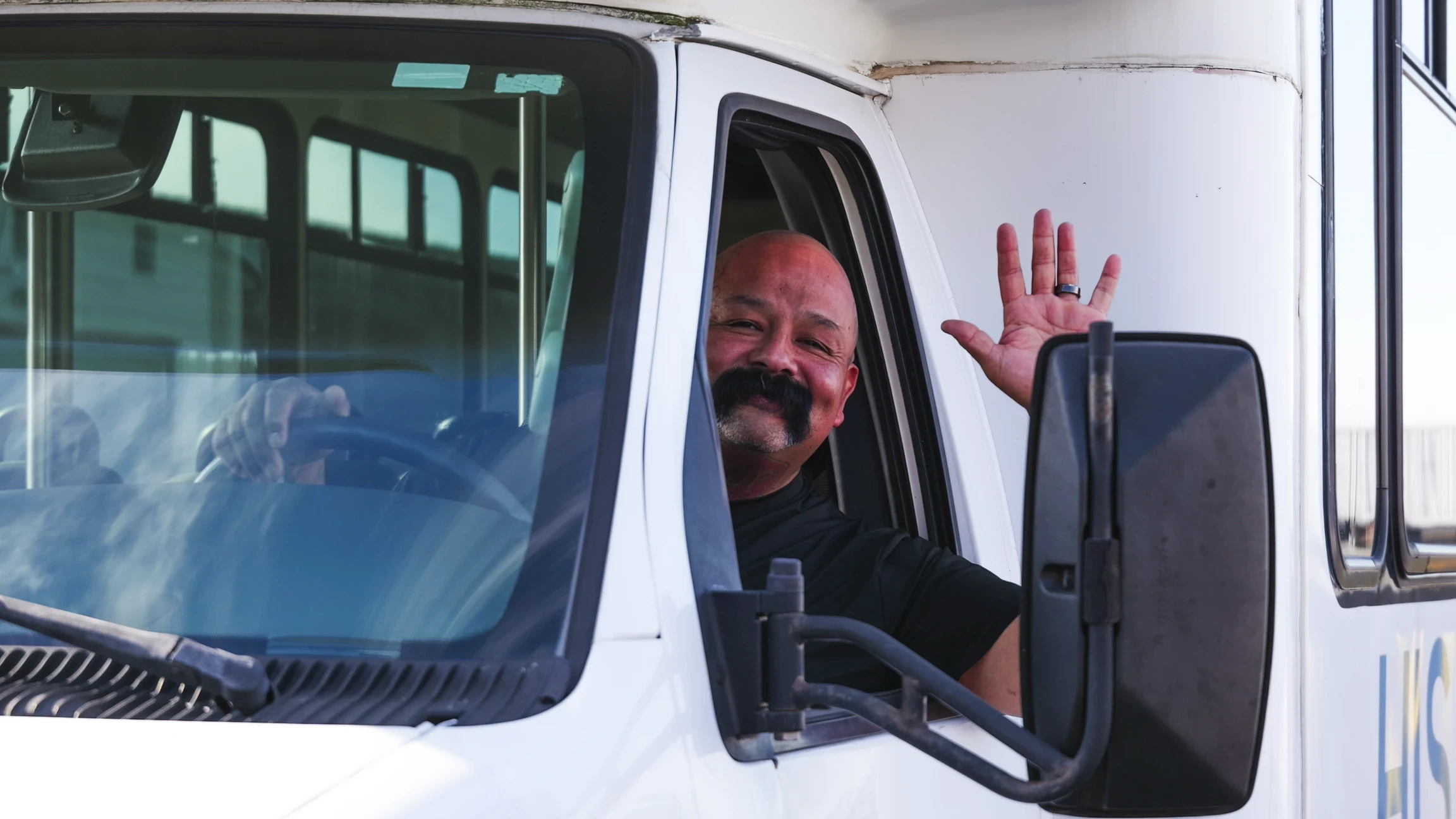 HIS-OC bus driving away after event end