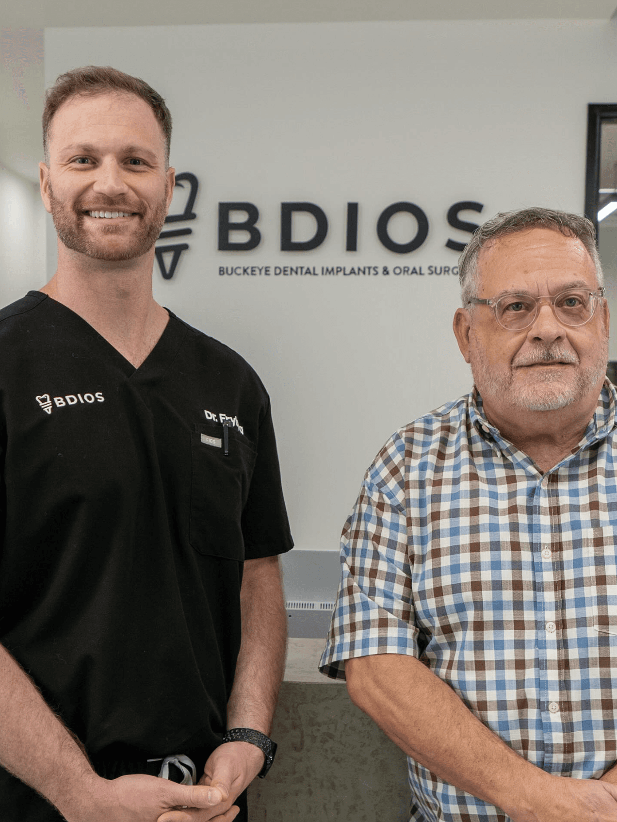 Modern dental clinic interior with reception desk and BDIOS wall logo signage