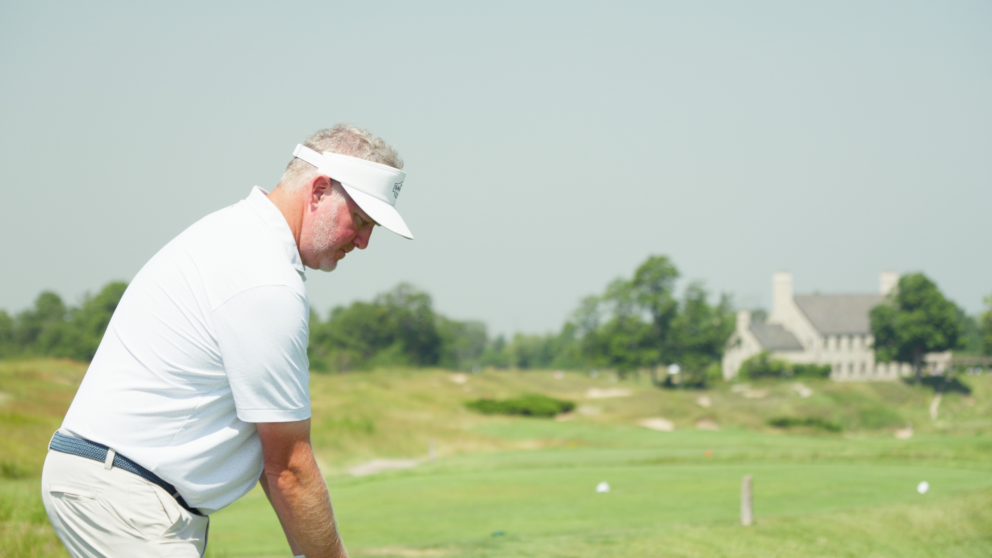 Golfer reading putt