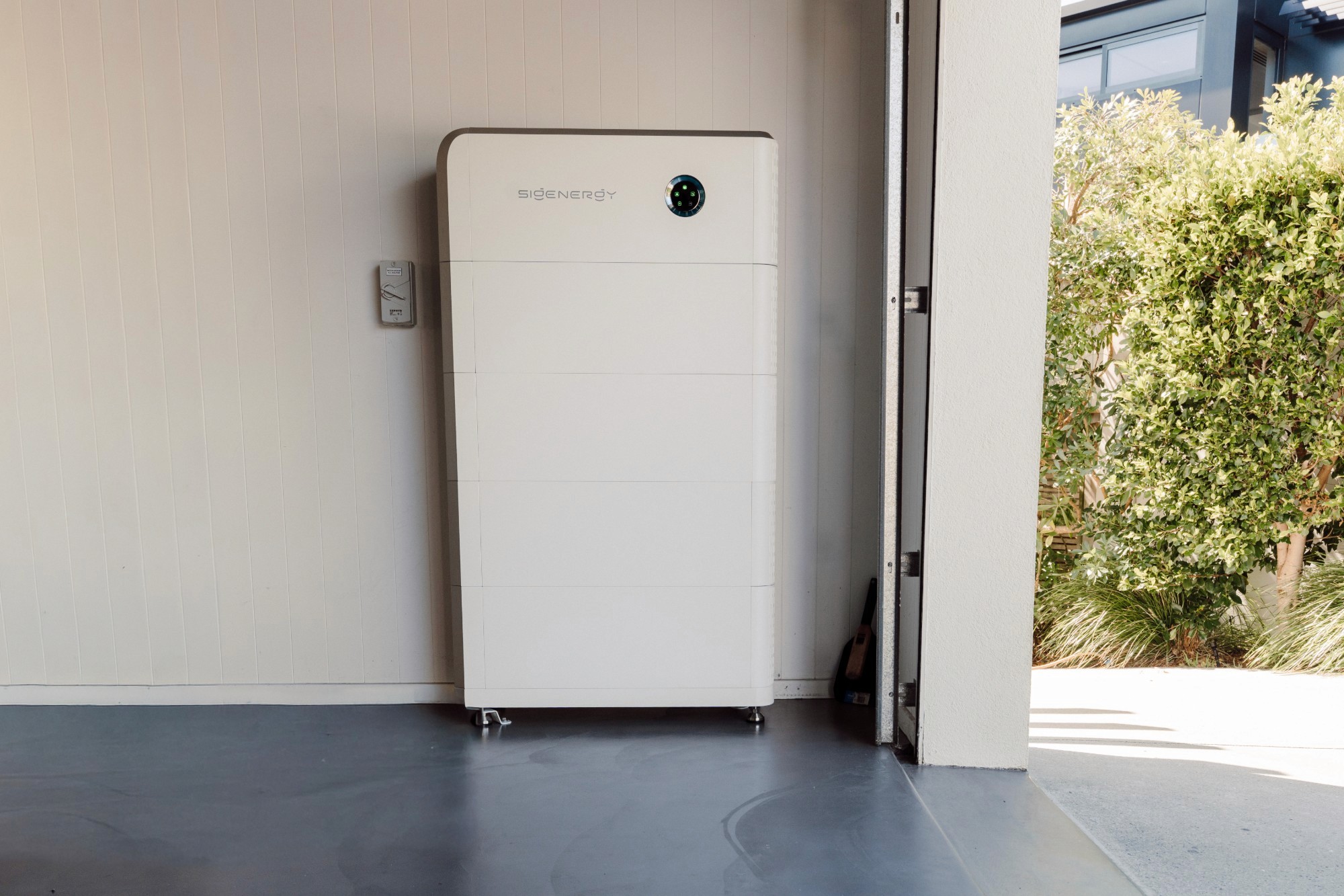The SigenStor inverter and four stacked battery modules in the garage, 36kWh of storage