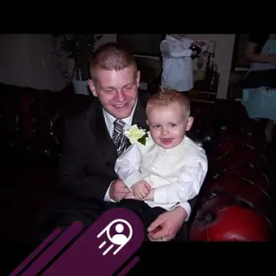 a man holding a baby