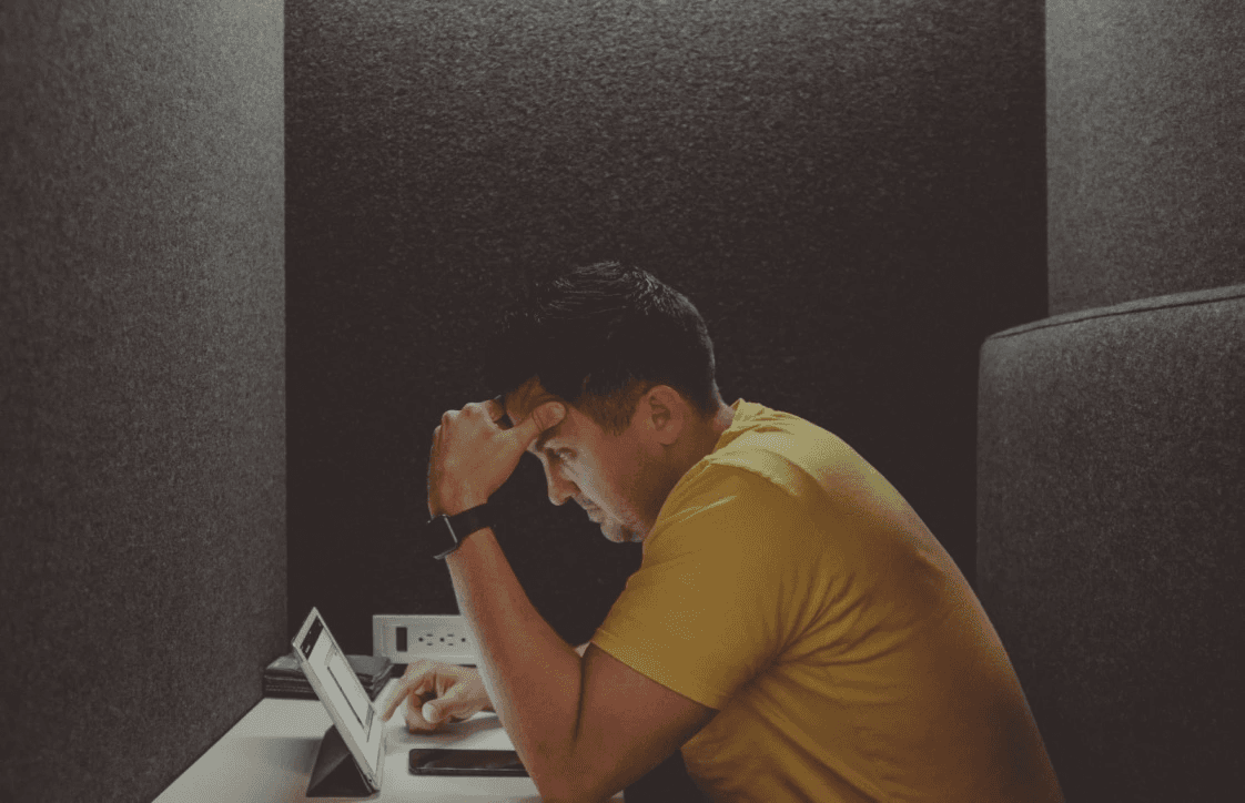 man looking confused at laptop