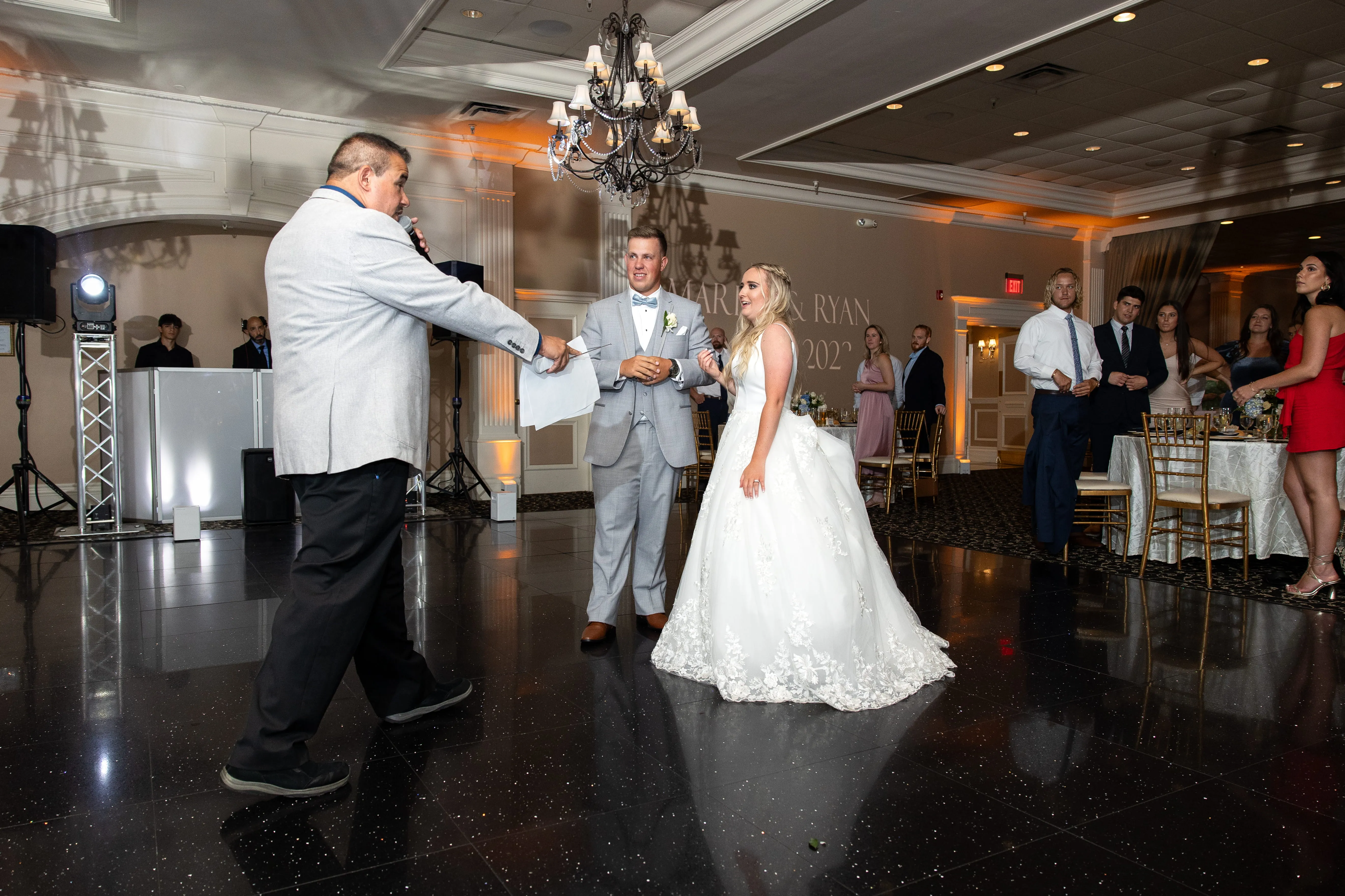 Wedding MC introducing couple and coordinating reception flow in NYC wedding