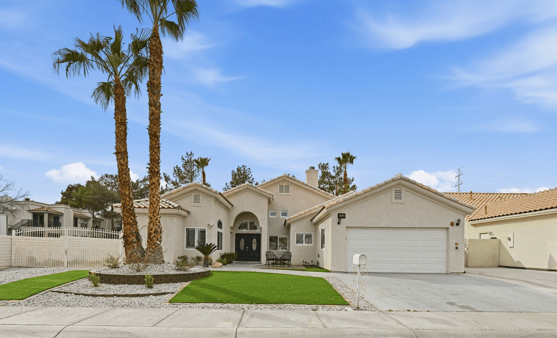 five children smiling while doing peace hand sign
