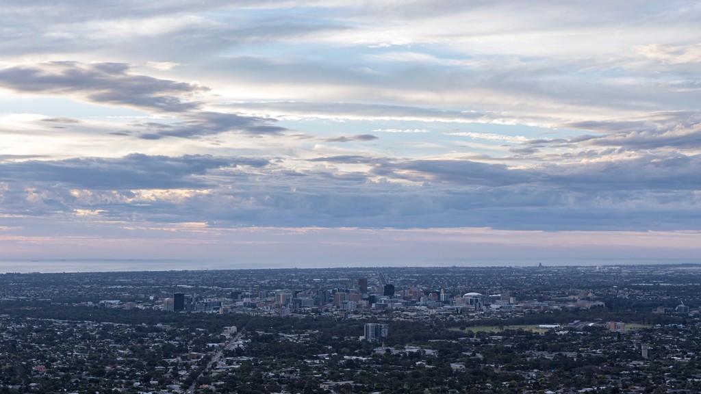 body of water under cloudy sky