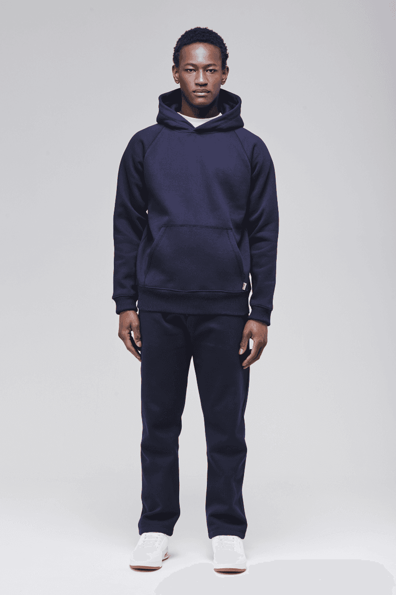 Sunday Superior Belmont Hoodie in rich navy, male model front view, classic fit.